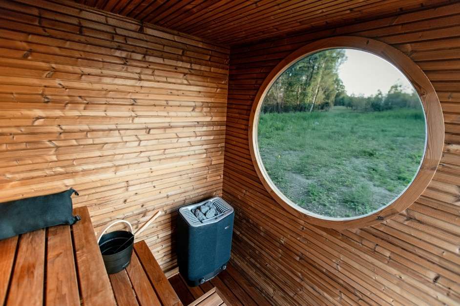 Outdoor sauna building with glass and wood exterior
