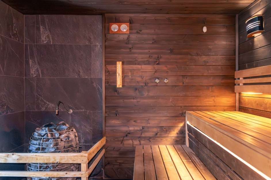 Custom wood indoor sauna with bench seating