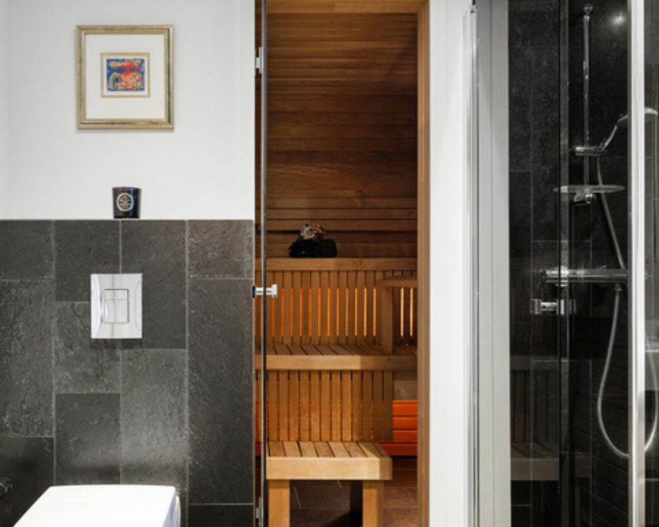 Custom indoor sauna with wood interior and bench seating in Virginia Beach