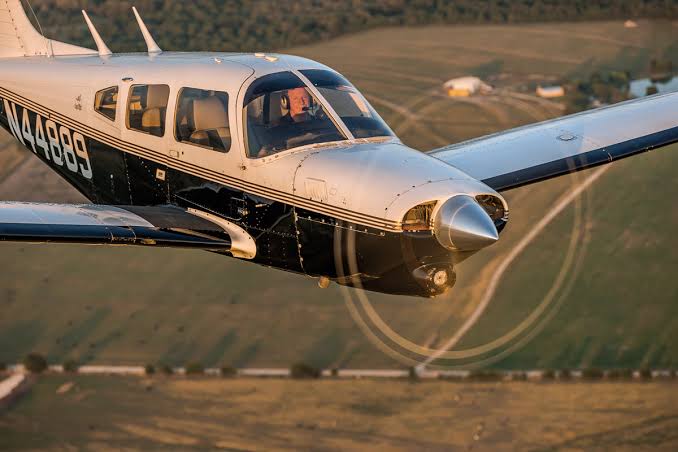 Retractable gear airplane in flight