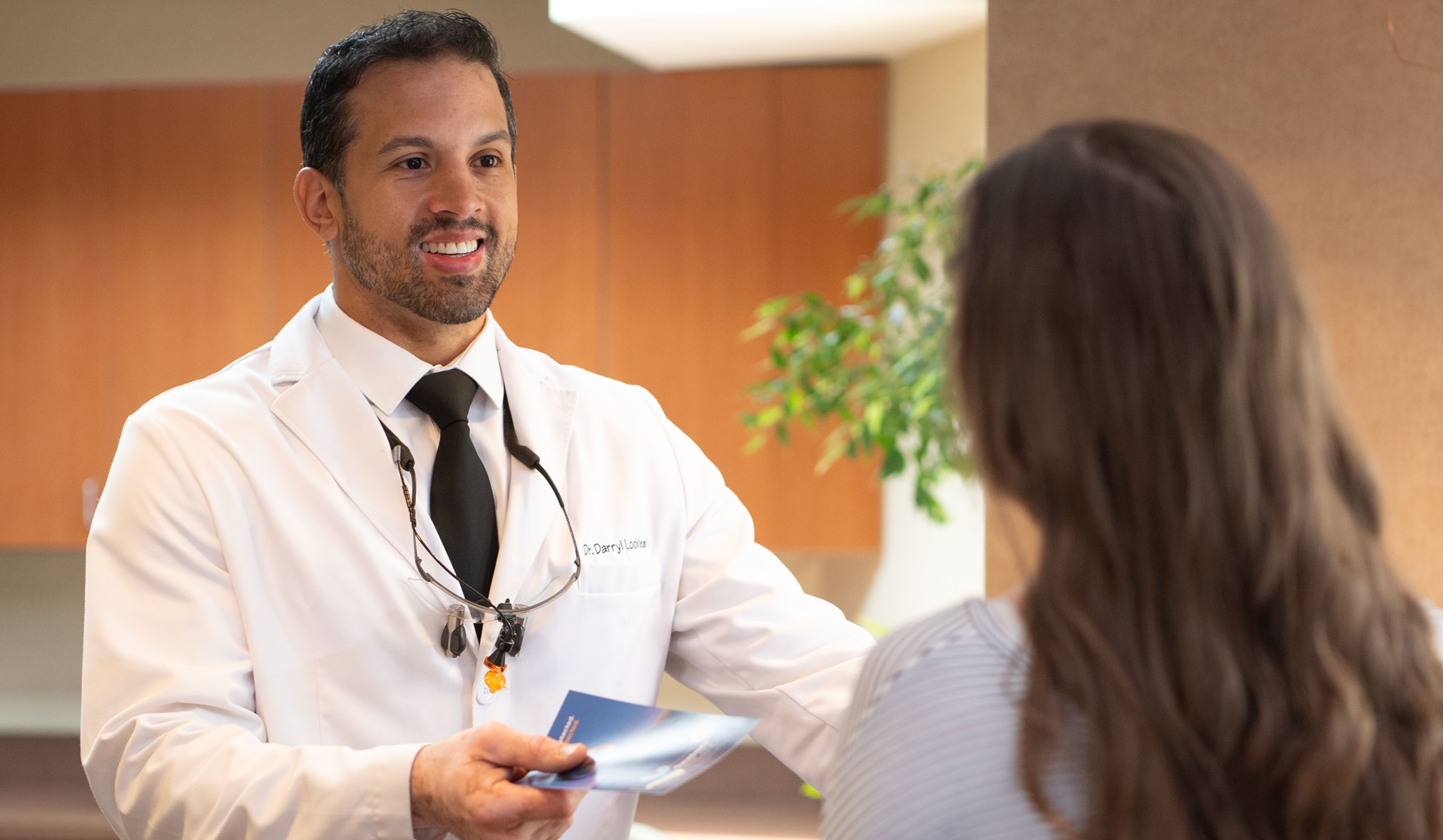 Woman holding invisalign