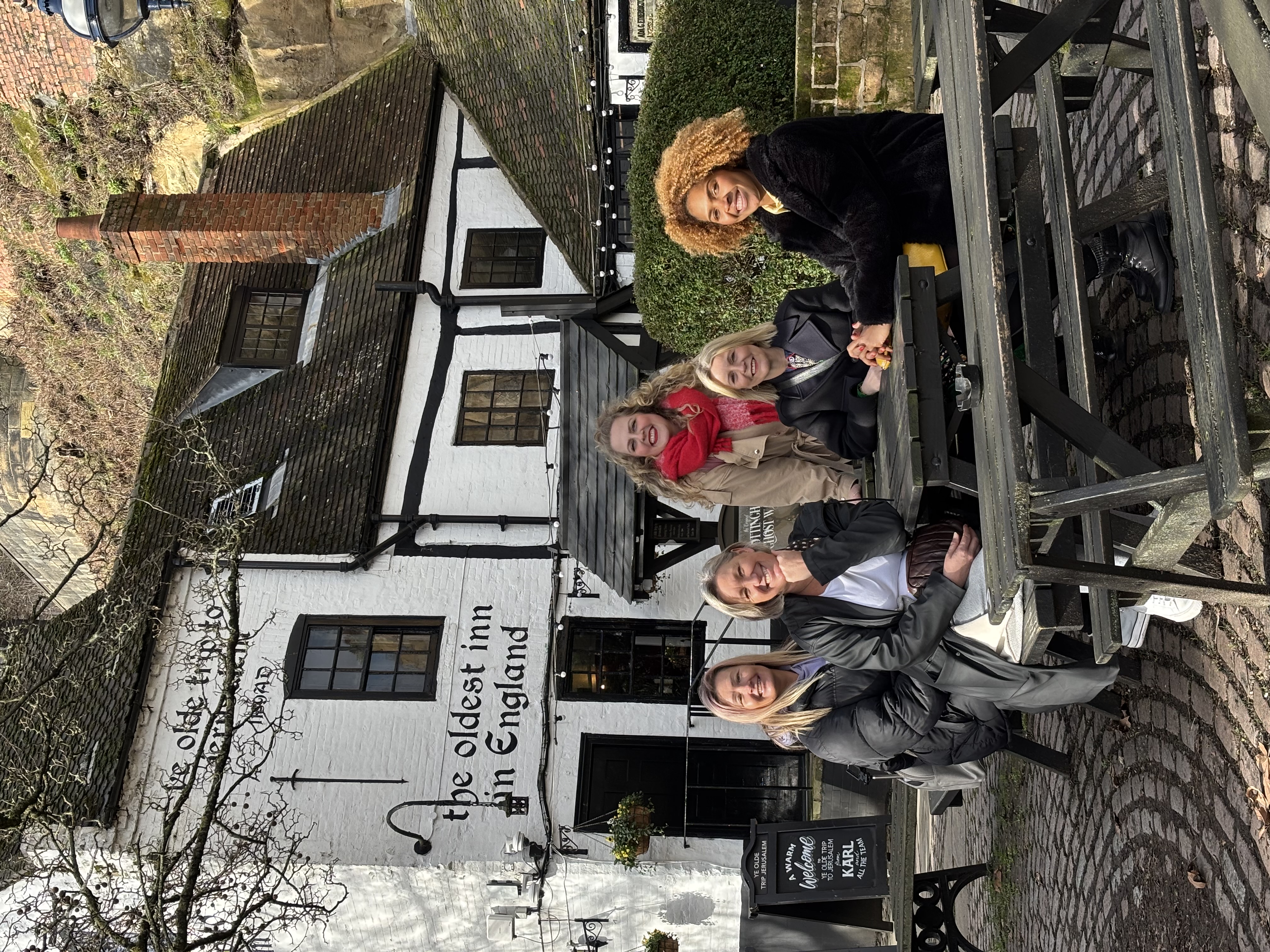 Group of 5 women sitting in front of the Ye Ol Jerusalem pub in Nottingham, smiling at the camera Group of 5 women sitting in front of the Ye Ol Jerusalem pub in Nottingham, smiling at the camera
