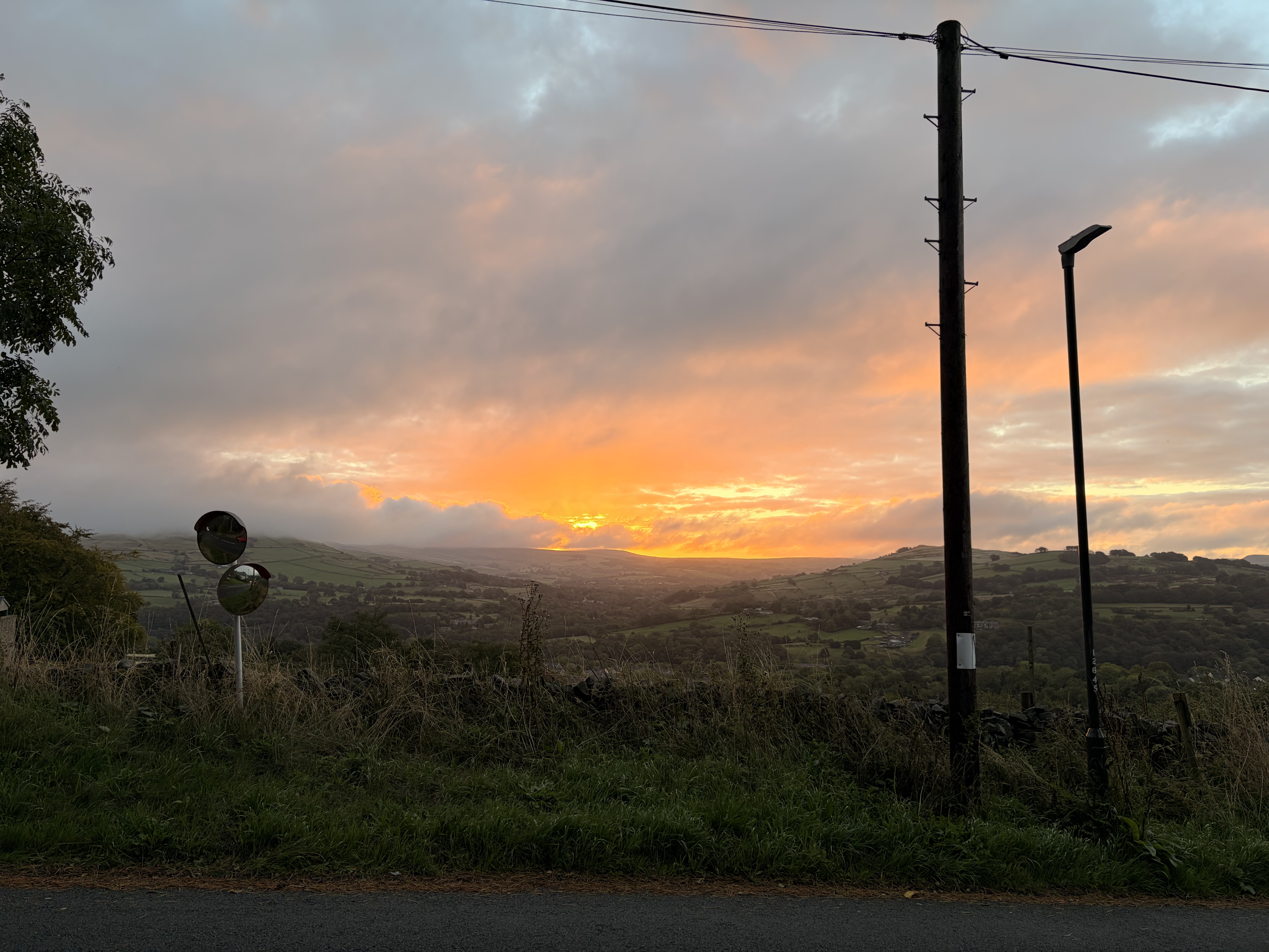 Sunrise over the hills, cloudy sky making the sight beautiful