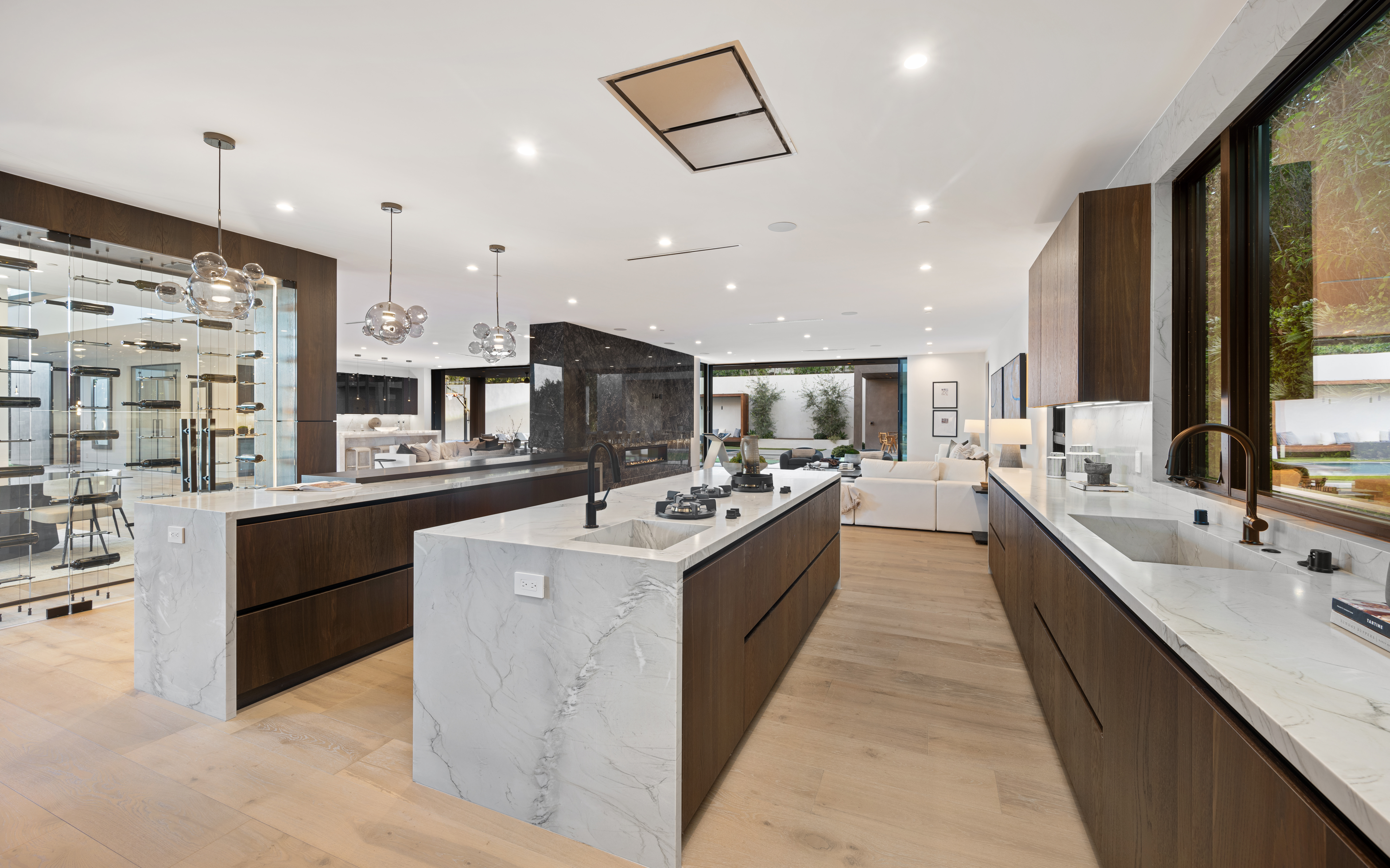Luxury kitchen remodel with marble waterfall island