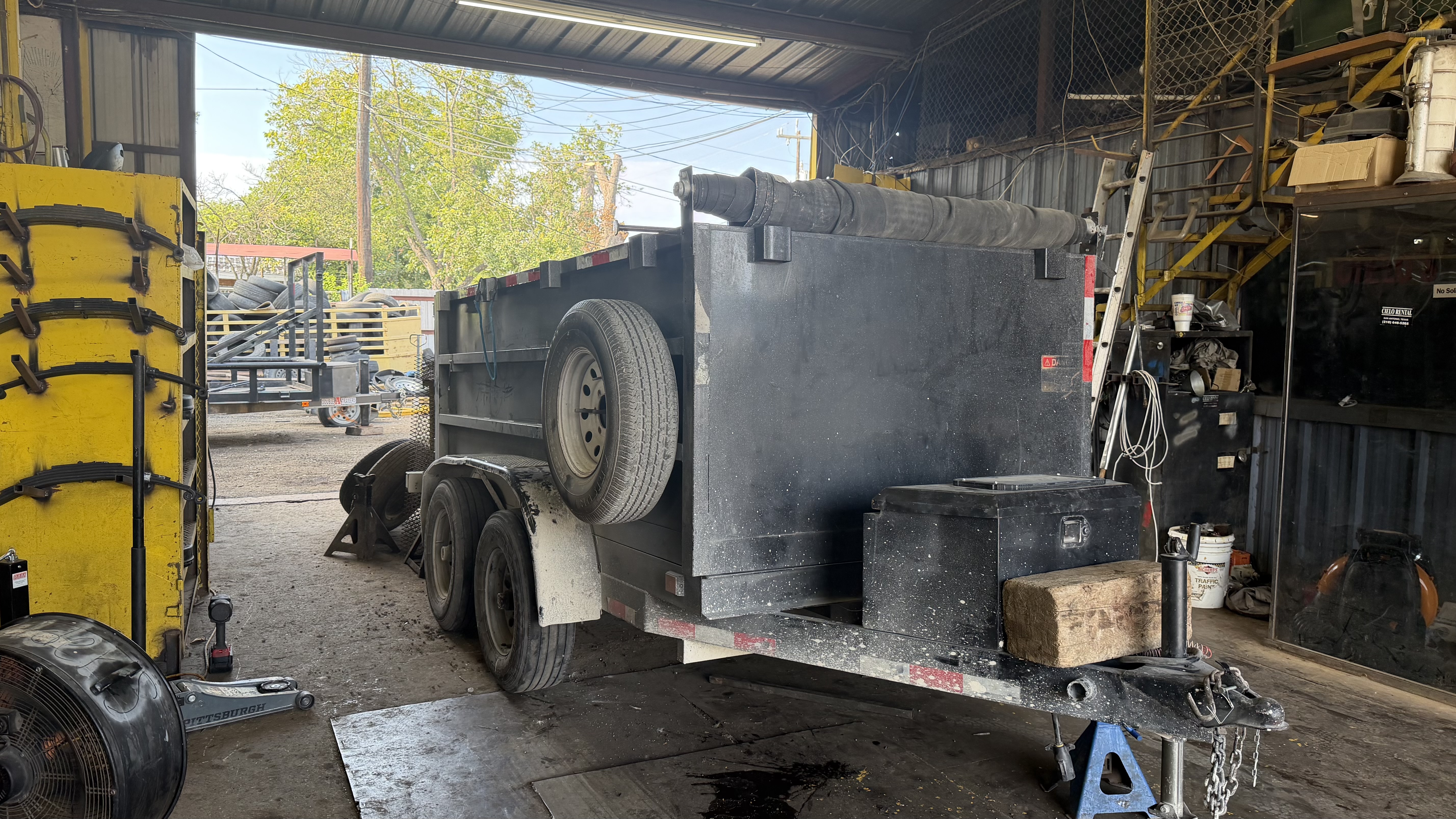 Dump trailer in the shop bay at Mr. Cielo Trailers