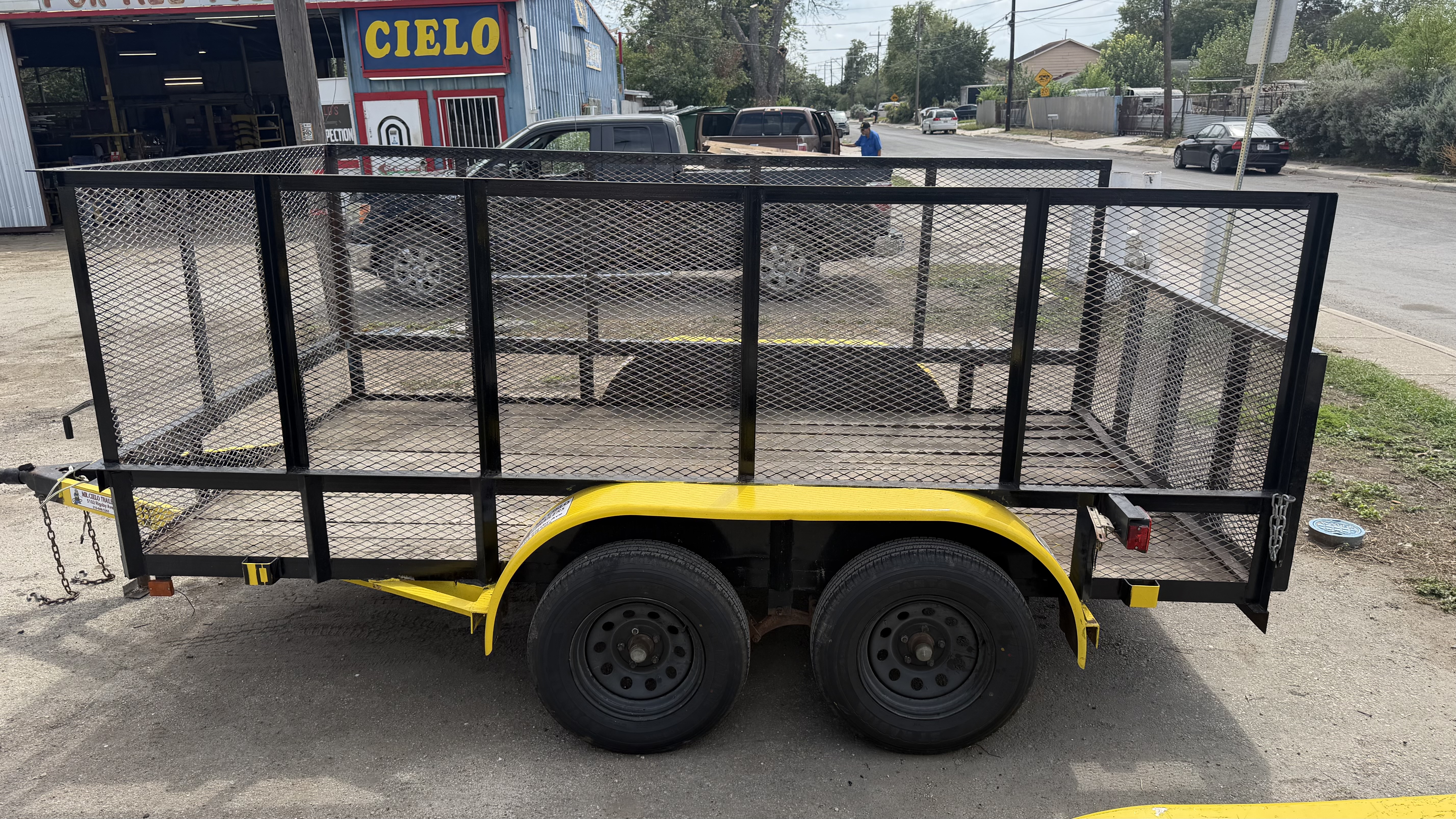 Utility trailer with mesh sides rebuilt and repainted at the Rigsby Ave shop