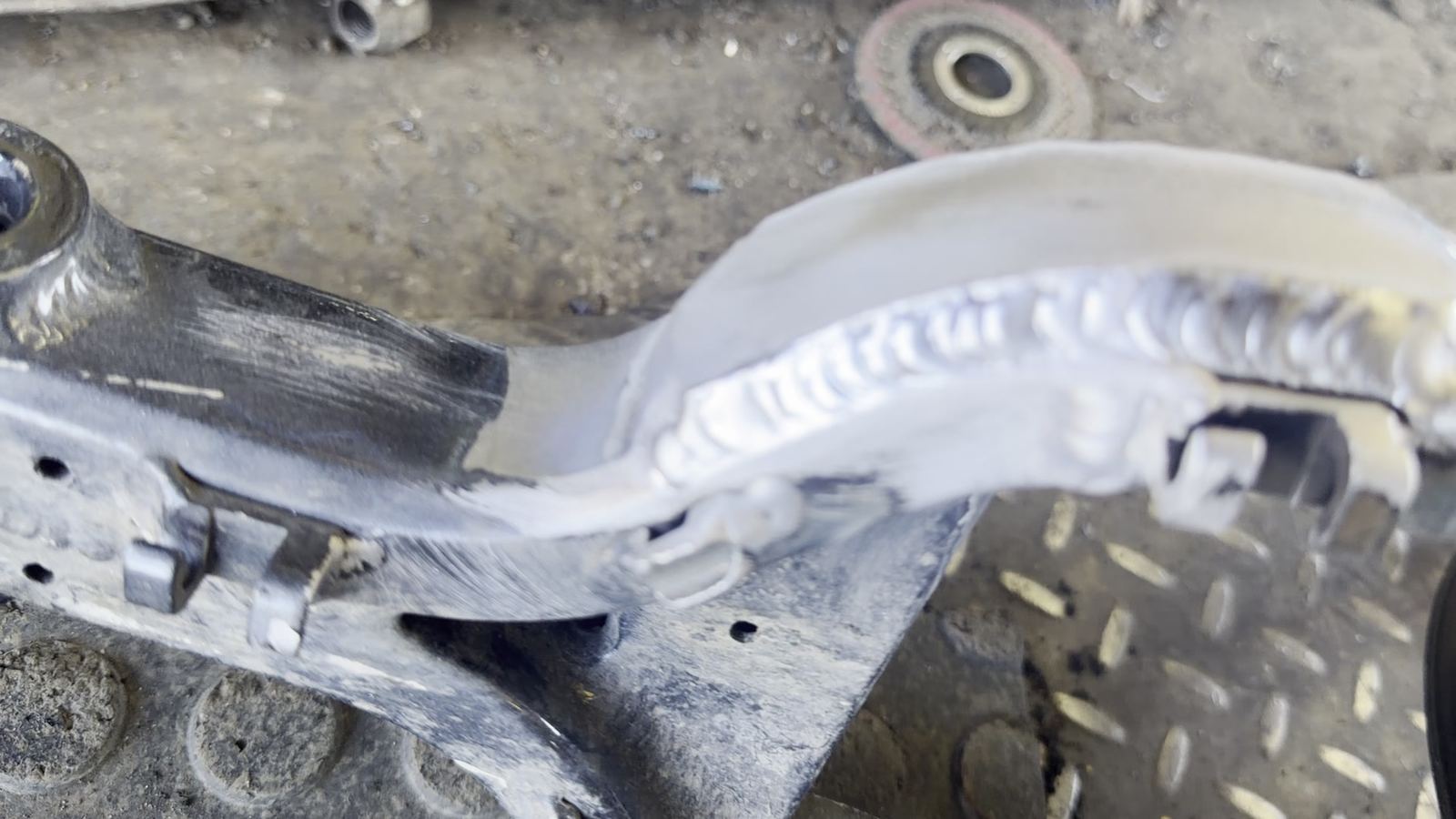 Finished aluminum weld bead on a repaired swingarm at Mr. Cielo Trailers in San Antonio