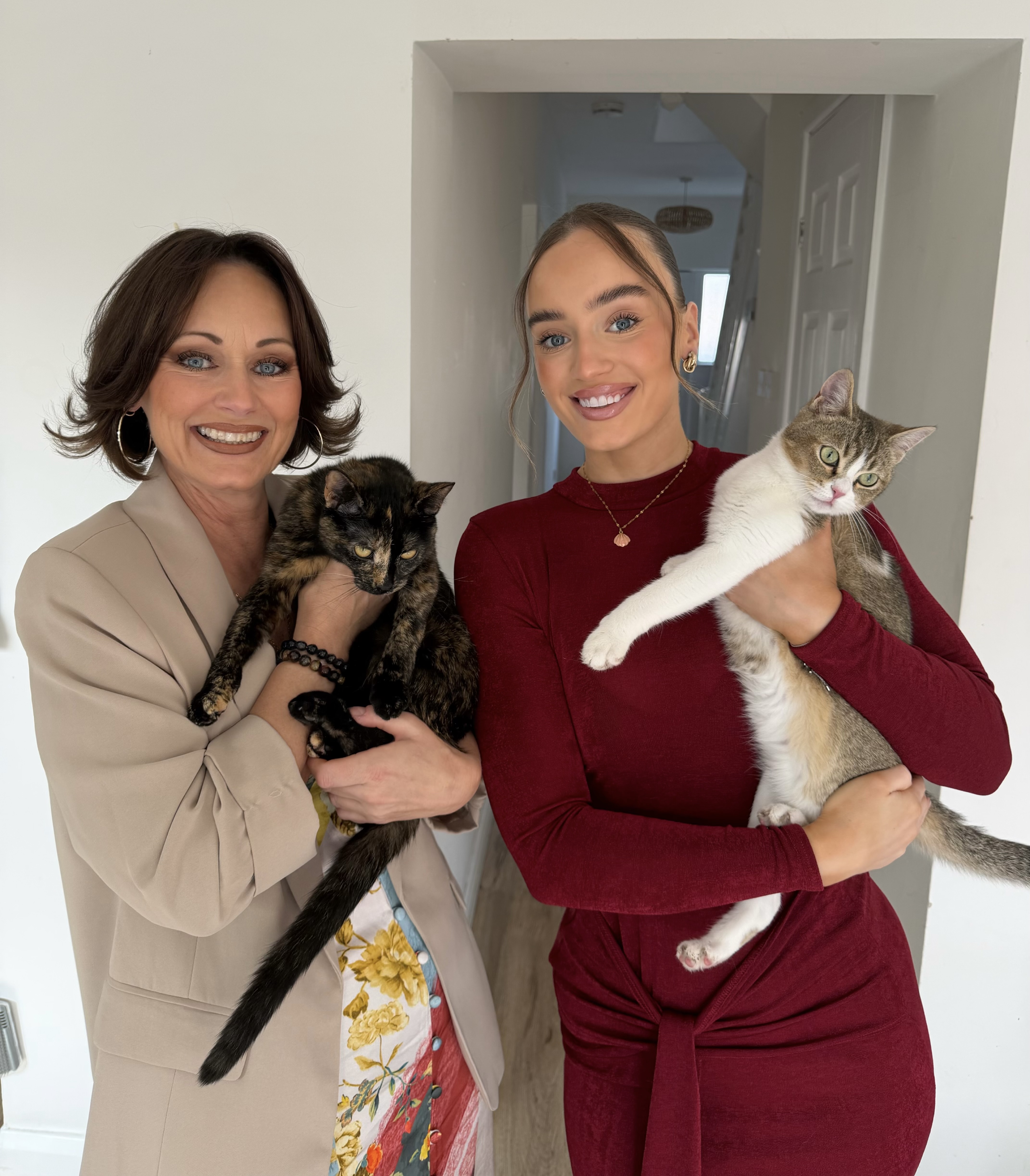 Andrea and Amber Hardman with their cats Ariel & Rosie who inspired their feline-first cat-sitting business My Three Cats Preston