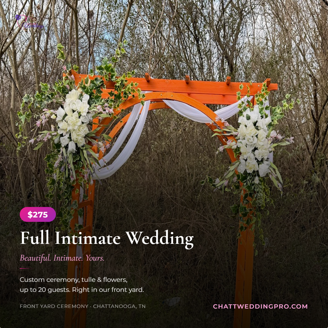 Wedding arch with white flowers and tulle in a front yard