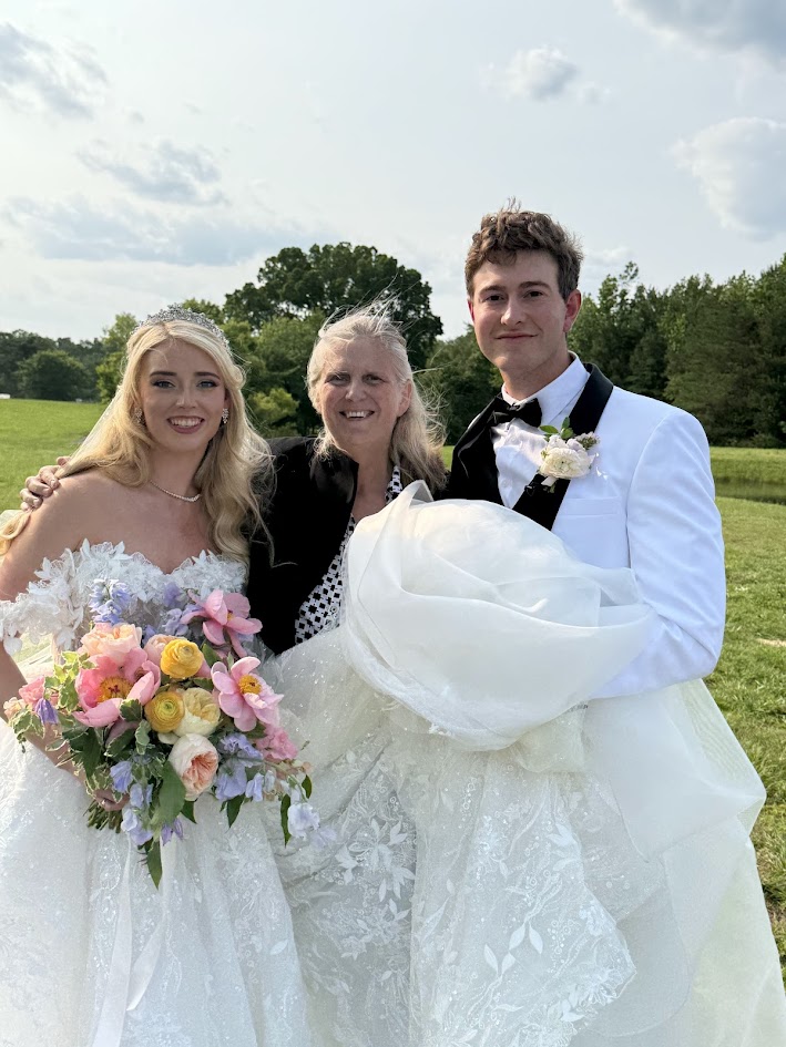 Officiant with a happy bride and groom