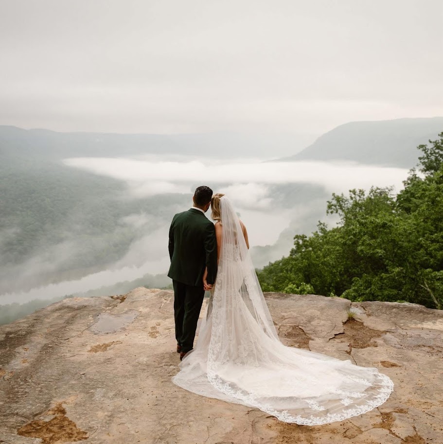 Couple overlooking a misty river valley