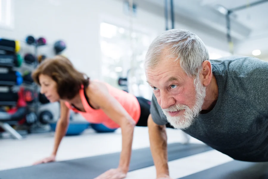 Older adults doing push-ups — strength training for healthspan Older adults doing push-ups — strength training for healthspan