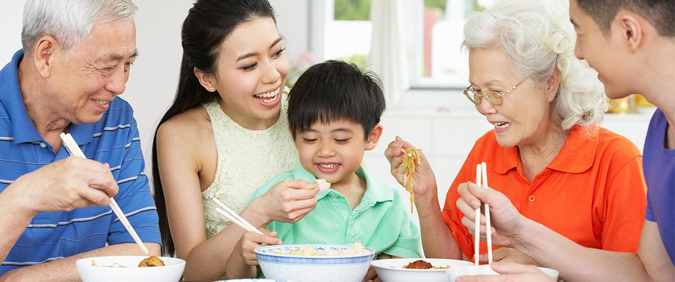 Multi-generational family enjoying a healthy meal together Multi-generational family enjoying a healthy meal together