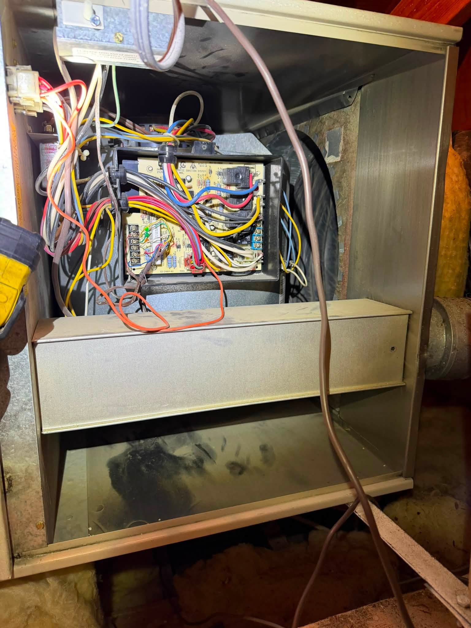 AC repair technician at work