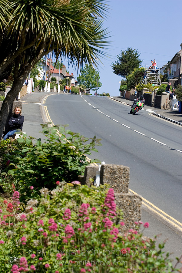 Relaxed spectator and Ian Mackman - GSXR Suzuki. Bray Hill.