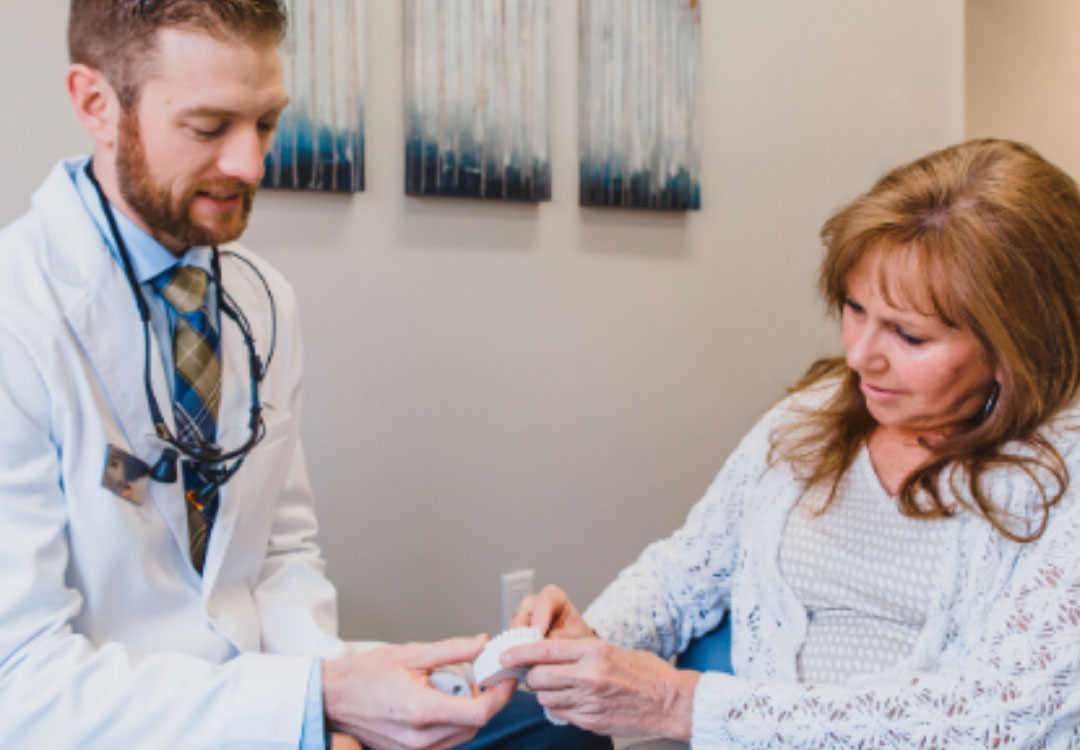 Woman holding invisalign