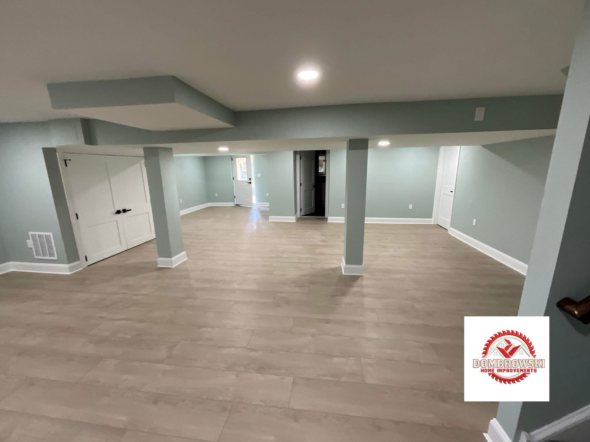 Finished basement with large format tile flooring in Bucks County, PA by Dombrowski Home Improvements