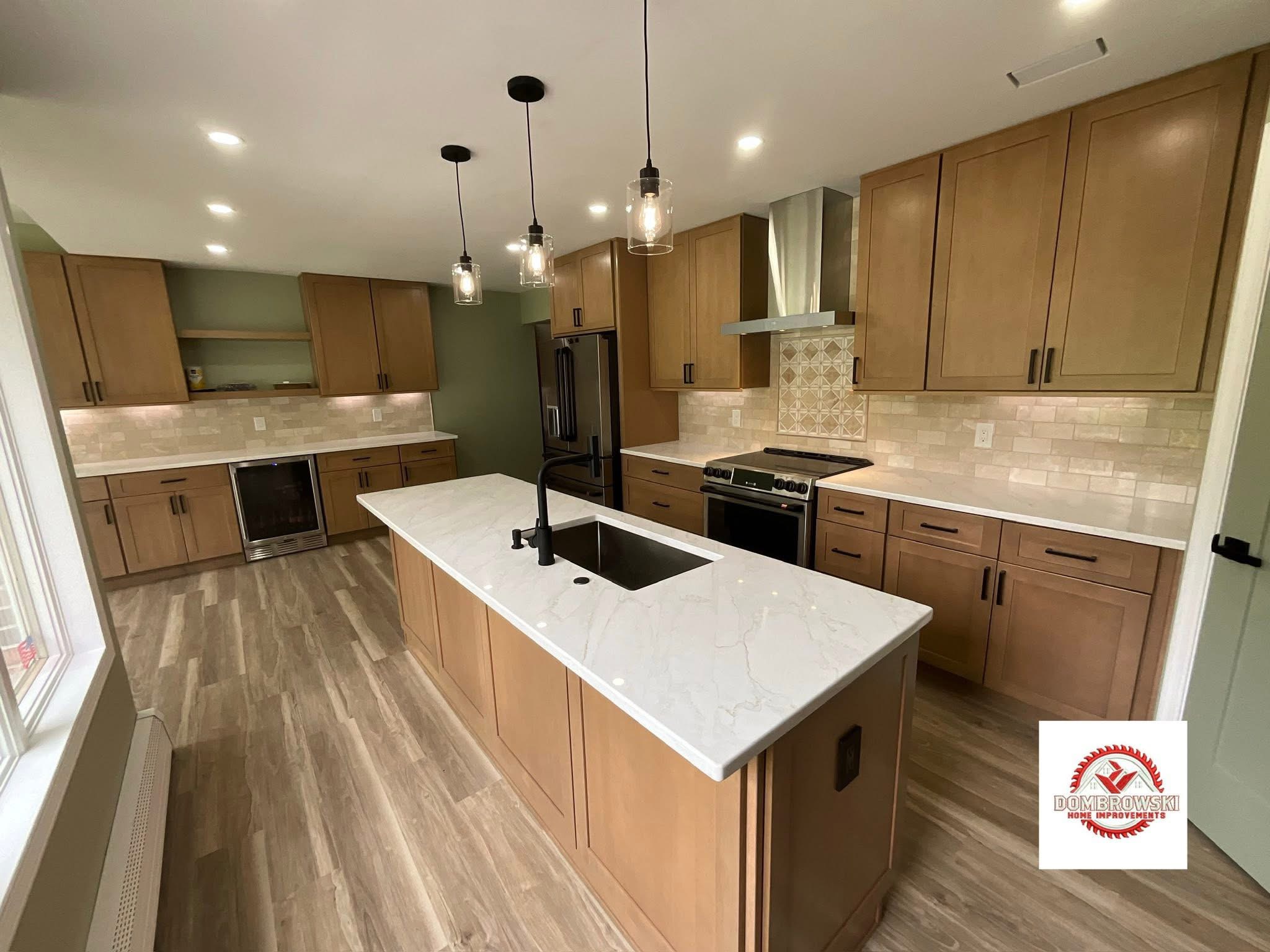 Natural wood kitchen remodel with quartz island, pendant lights and sunroom addition, Dombrowski Home Improvements Bucks County PA