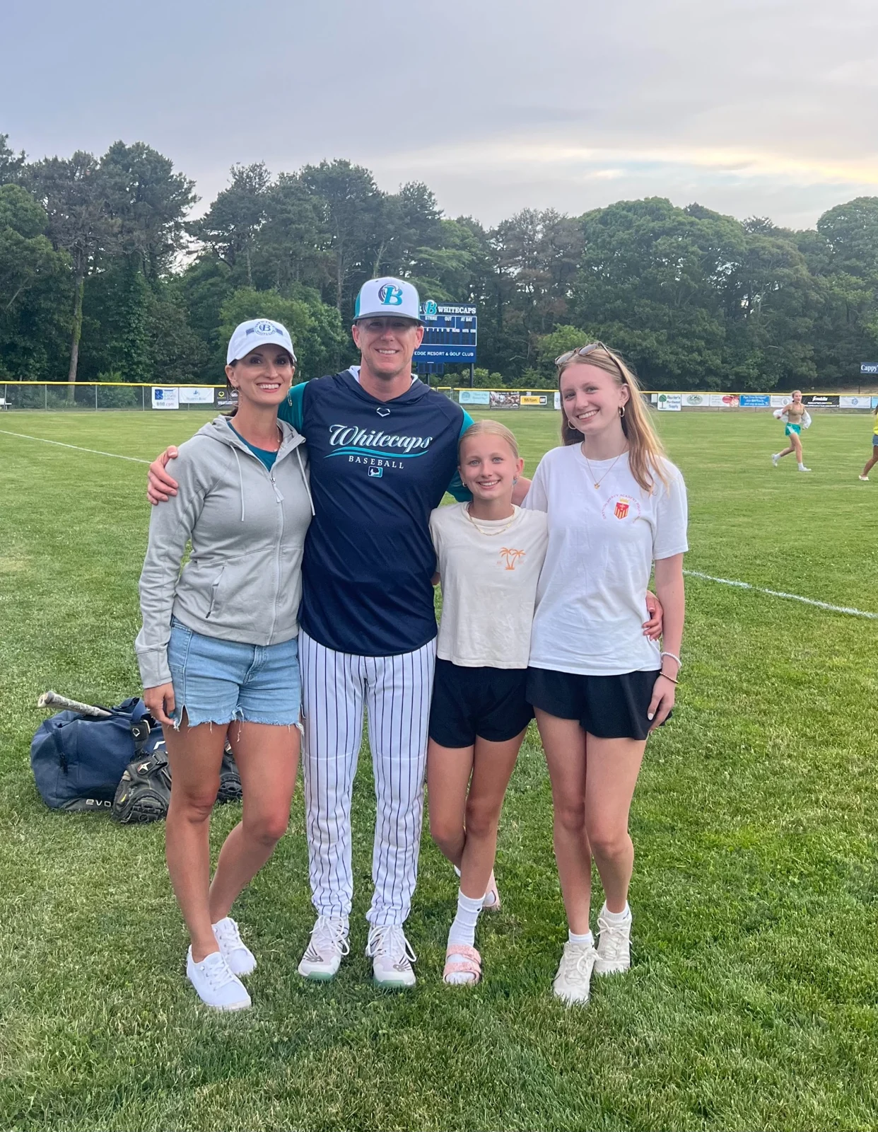 Megan, Nick and their family together on a sports field