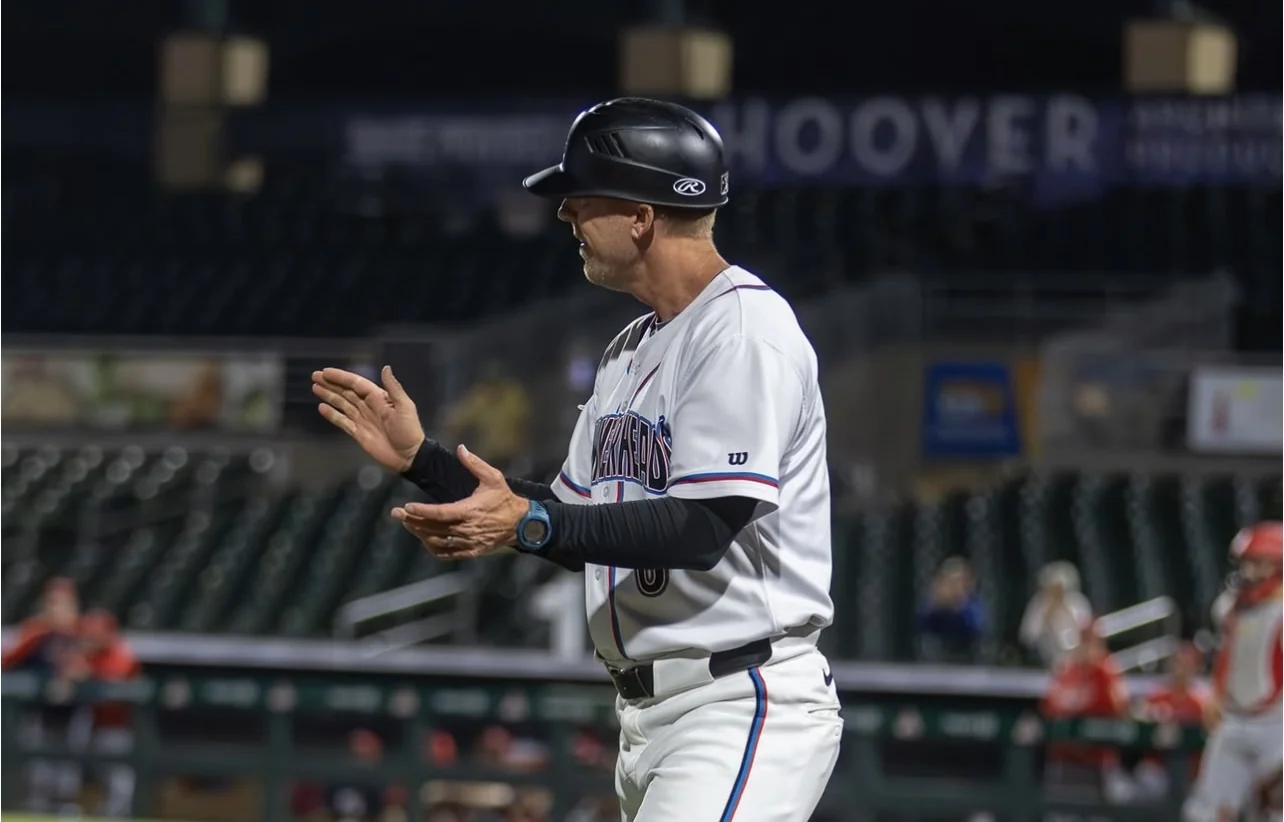 Nick Weisheipl coaching beside the field