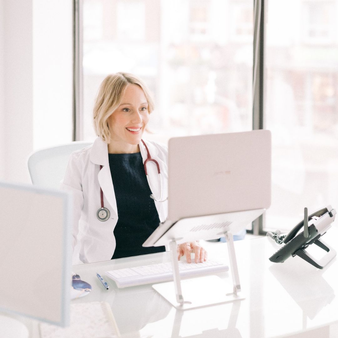 Dr. Tara Campbell at her desk at Higher Health Naturopathic Centre