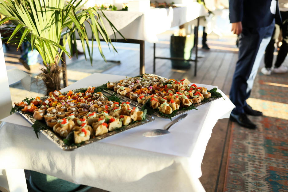 A clean, professional corporate lunch catering spread with upscale platters and fresh ingredients for business conferences in Portland, Maine.