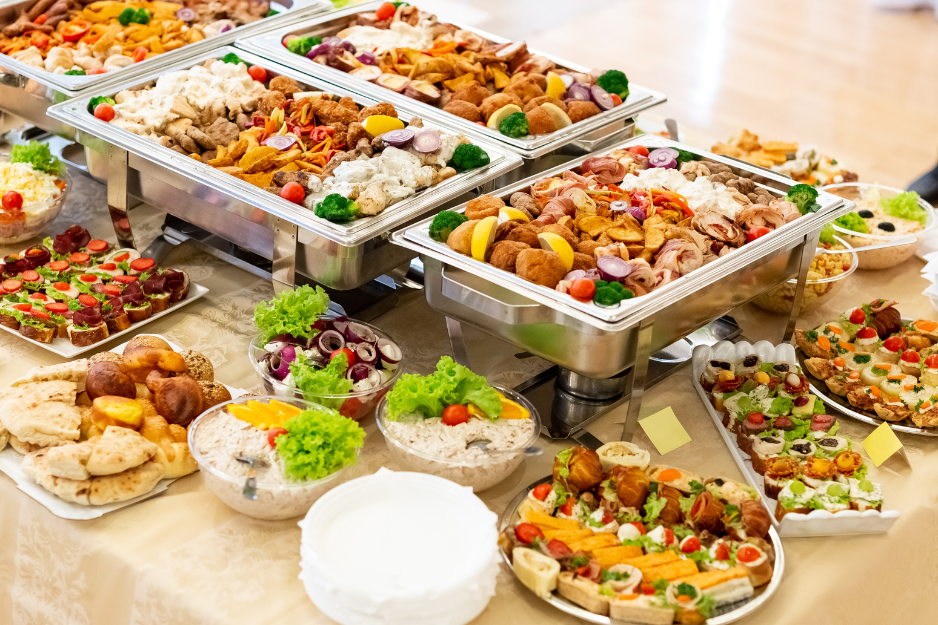 A beautifully catered family-style dinner layout for a private rehearsal dinner or milestone anniversary celebration in Southern New Hampshire.