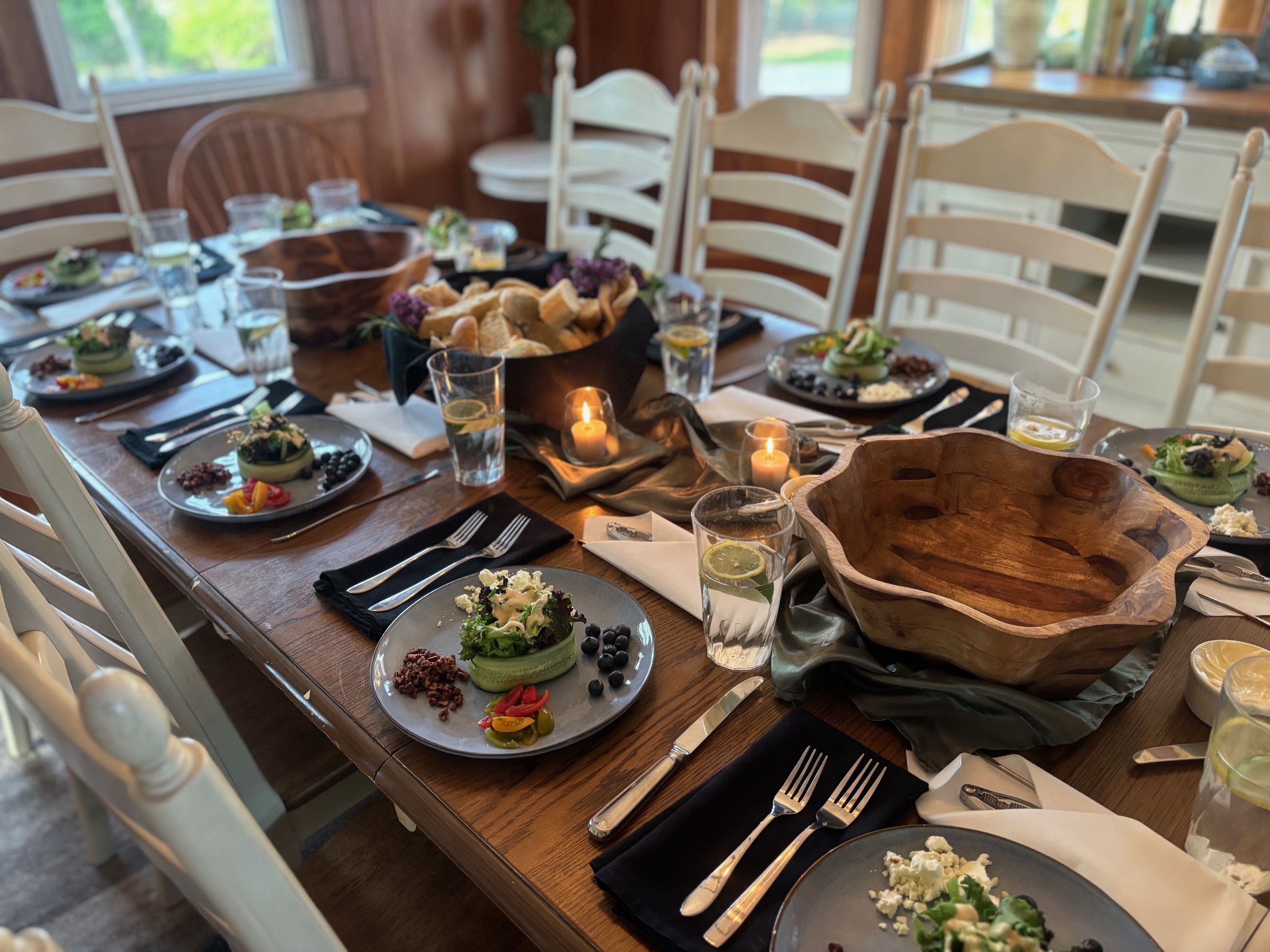 A beautifully catered family-style dinner layout for a private rehearsal dinner or milestone anniversary celebration in Southern New Hampshire.