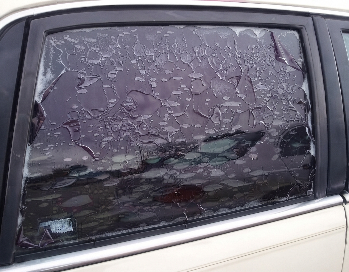 Cheap window tint bubbling and peeling