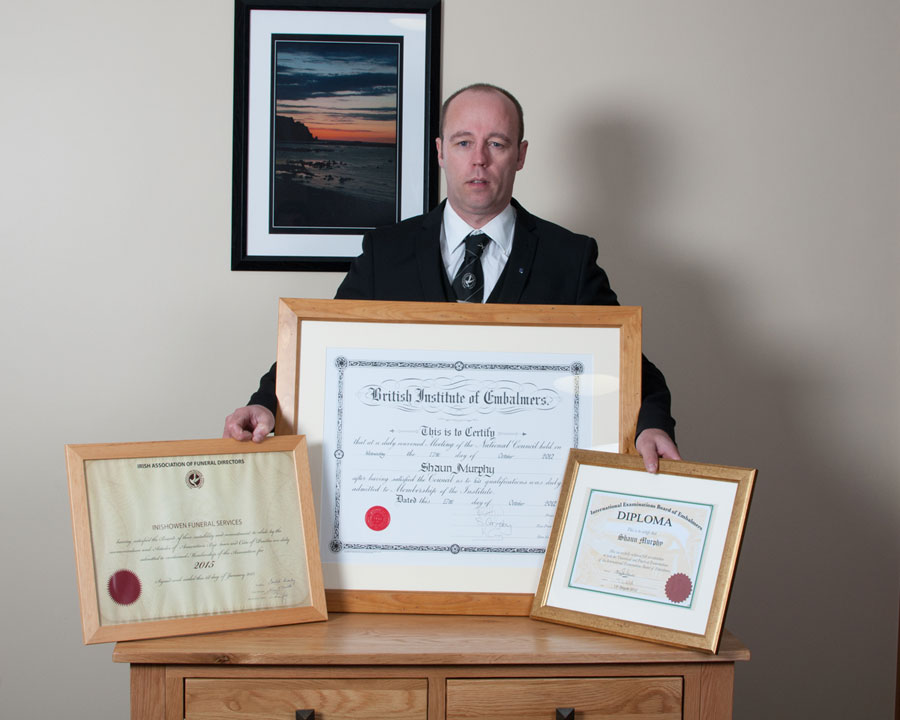 Shaun of Inishowen Funeral Services with his embalming certificates