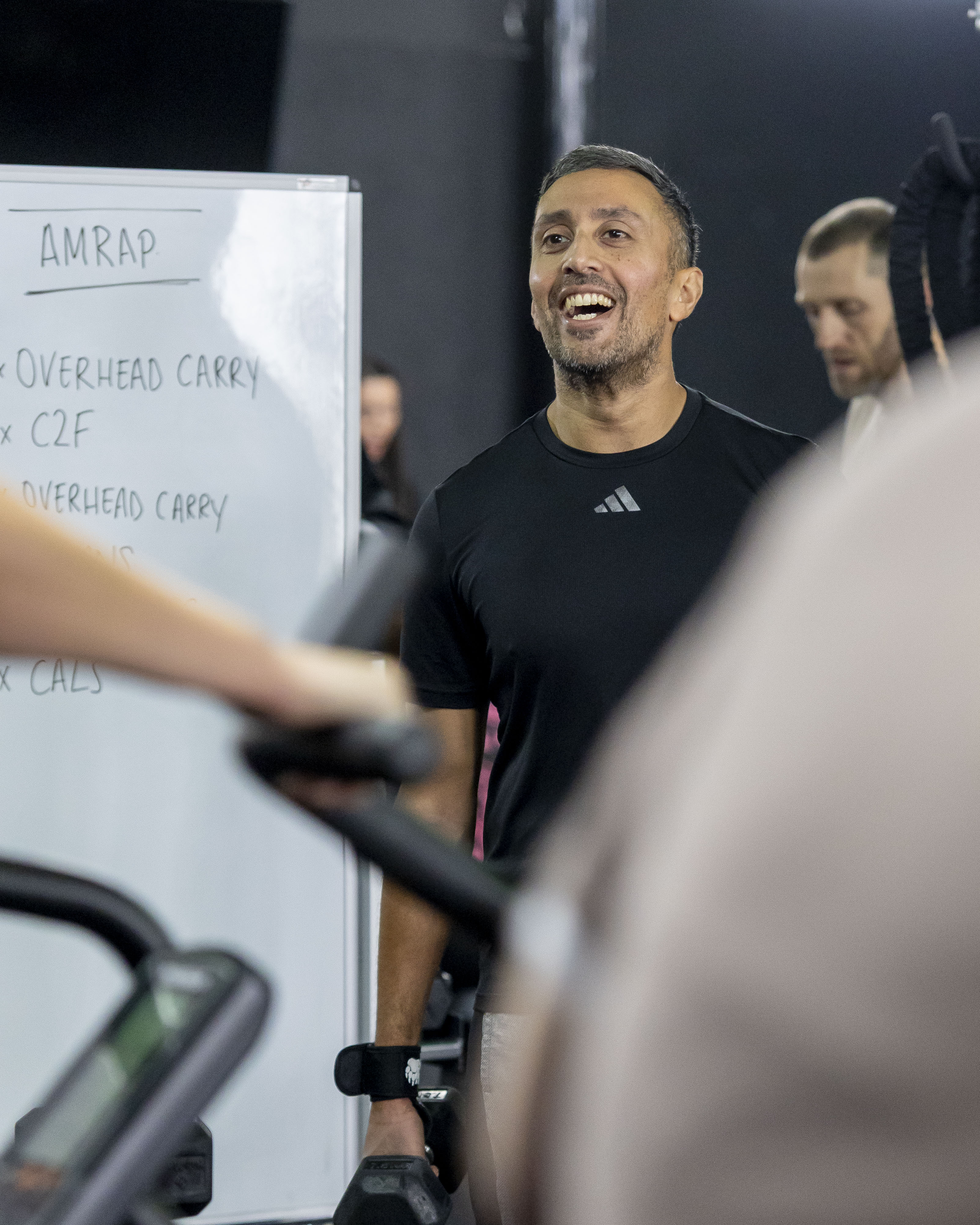 Personal trainer supporting members at Benchmark Gym in Stockport