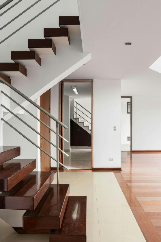 woman setting sheets on bed