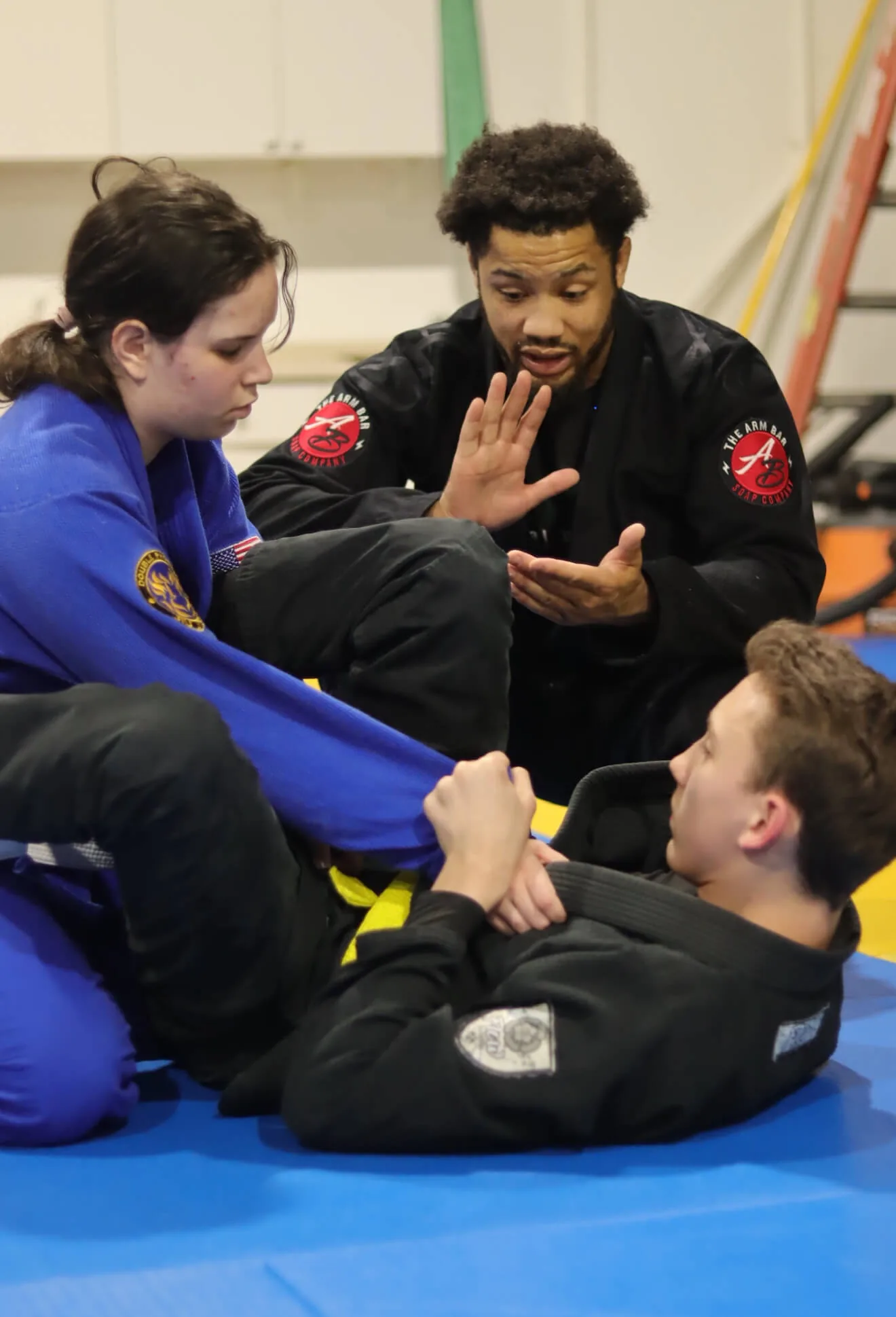 Coach Shane Jamil Hill-Taylor teaching kids at Apex Sterling