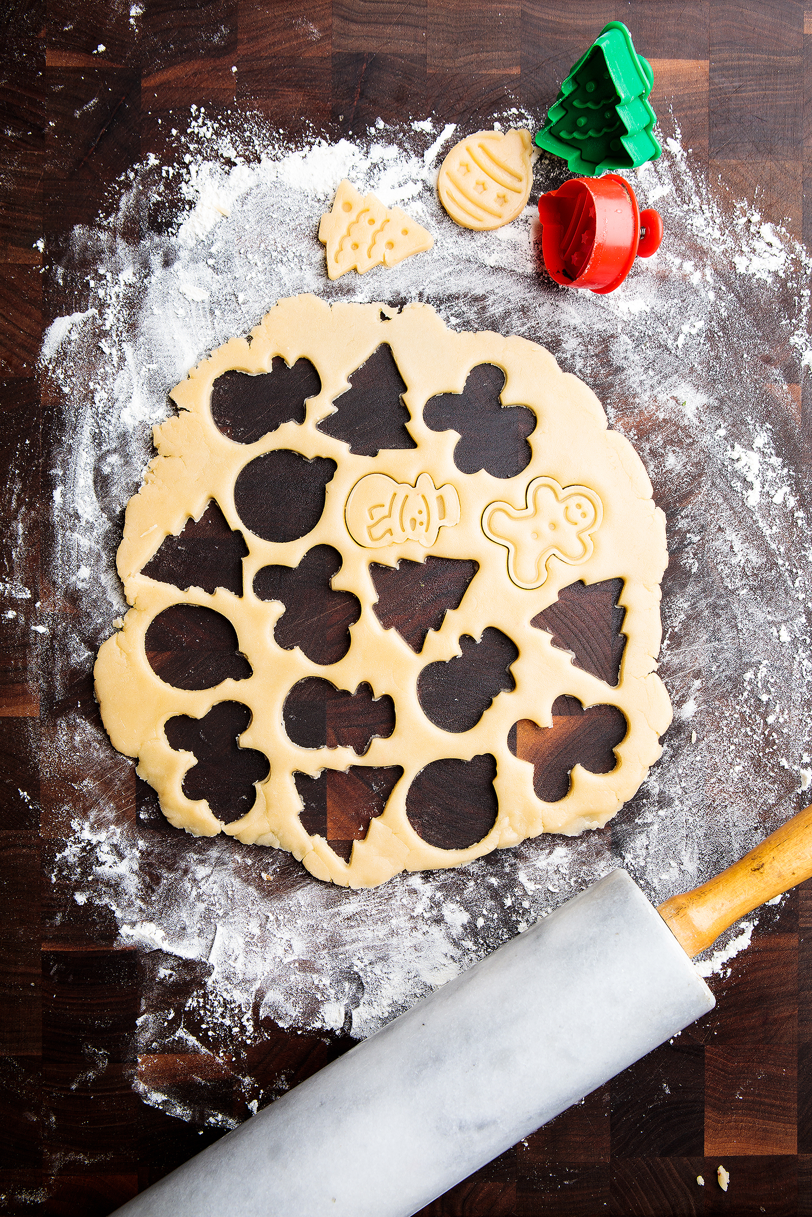 Vegan Christmas cookie dough with holiday cookie cutters and rolling pin, photographed for Audrey Dunham’s Vegan Christmas Cookies & Cocoa cookbook.