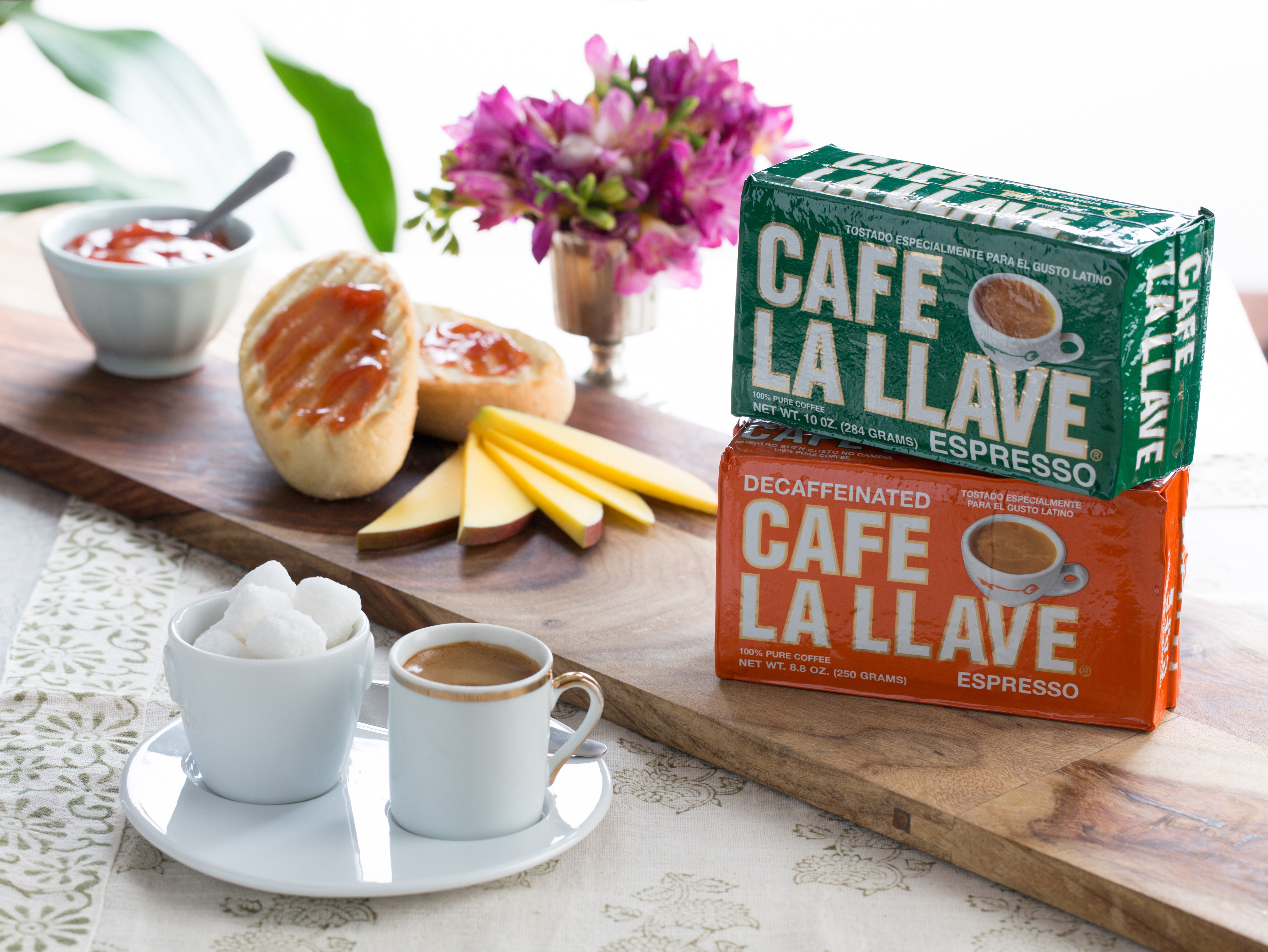 Commercial coffee photography featuring Café La Llave espresso packaging with a styled espresso setup, photographed in Los Angeles for food and beverage brand marketing.