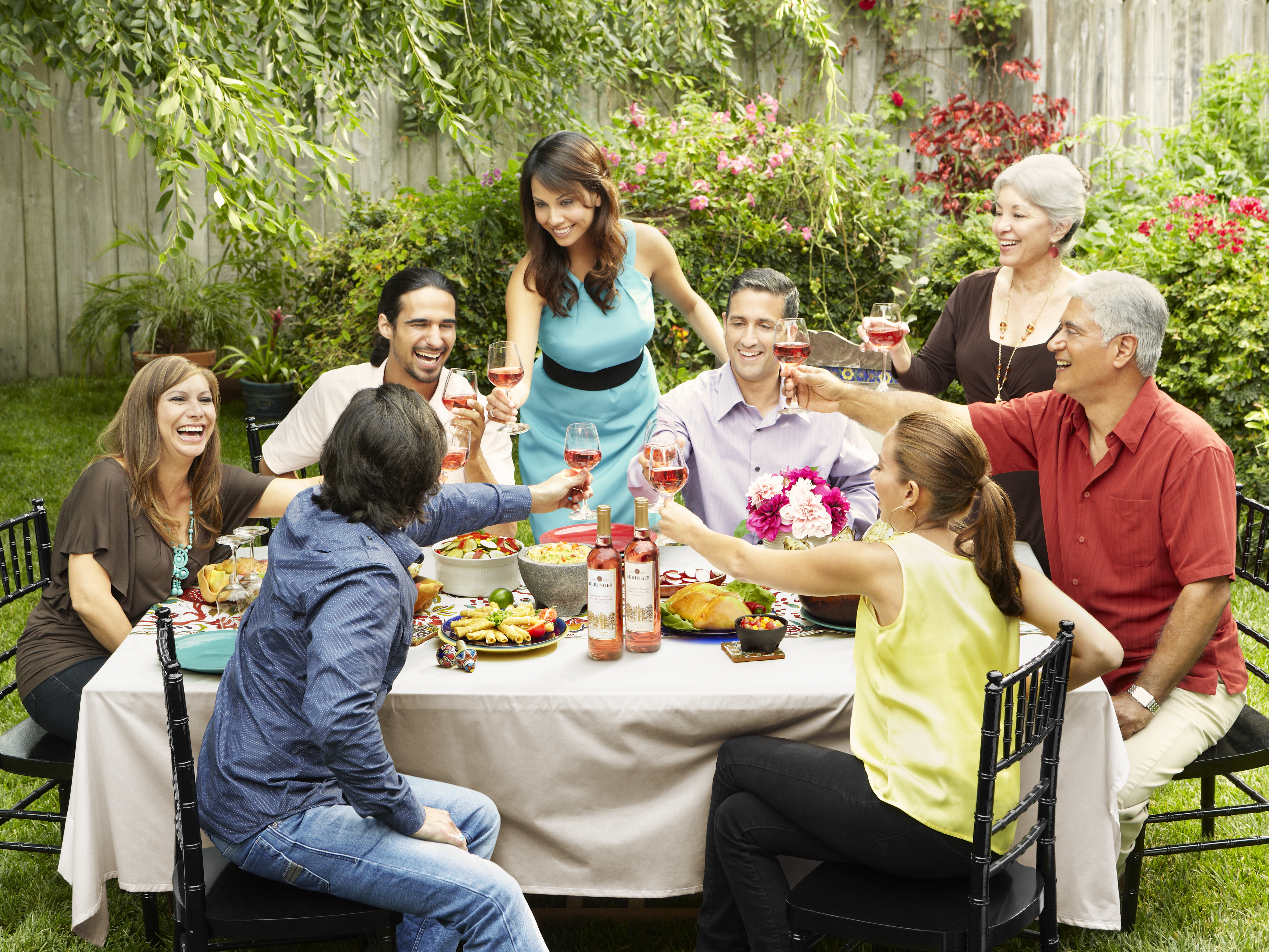 Lifestyle wine photography of a group enjoying wine and food outdoors, photographed in Los Angeles for food, beverage, and wine brand marketing campaigns.