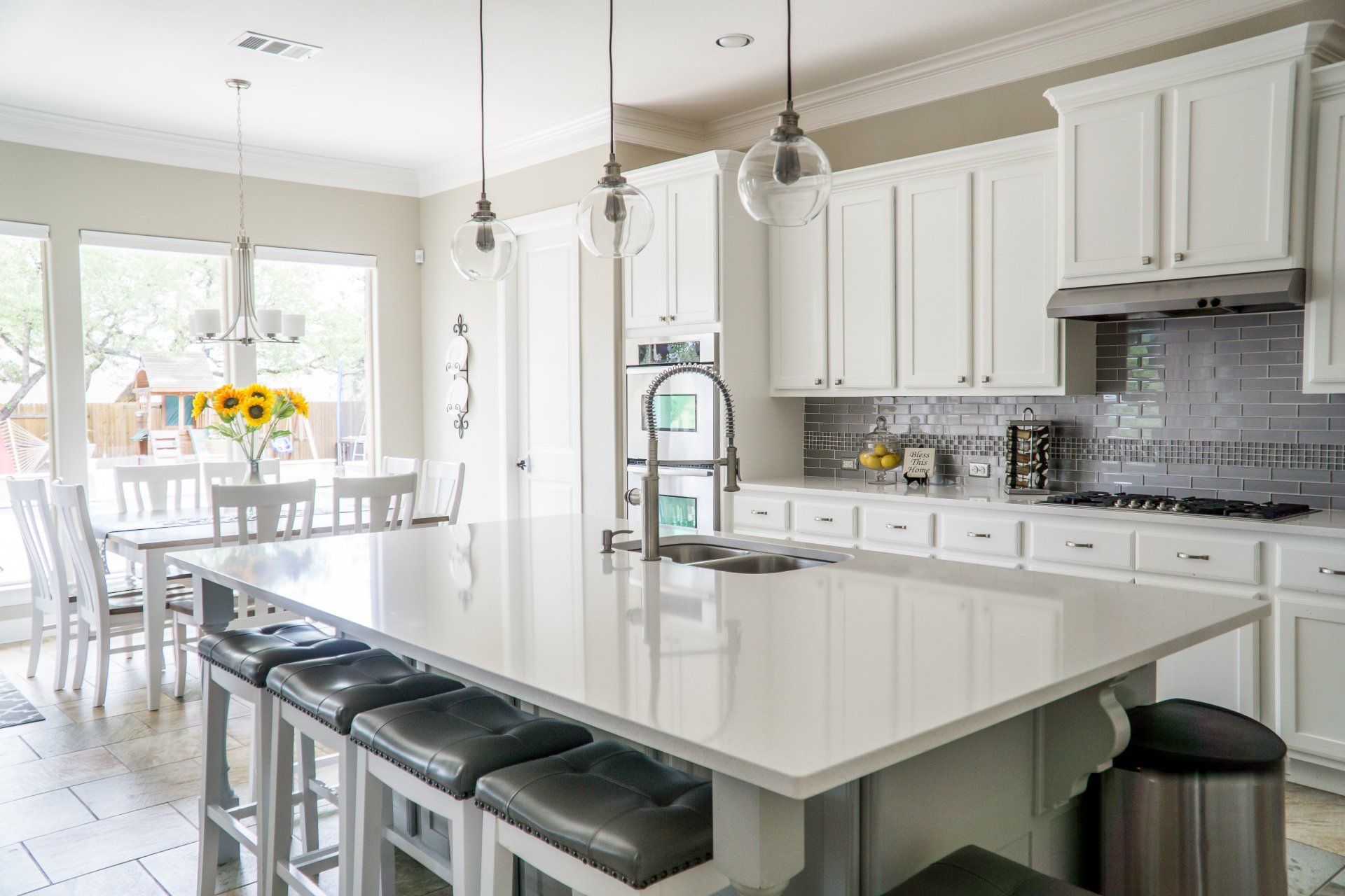 White kitchen with an island after a home remodel in Lubbock, TX