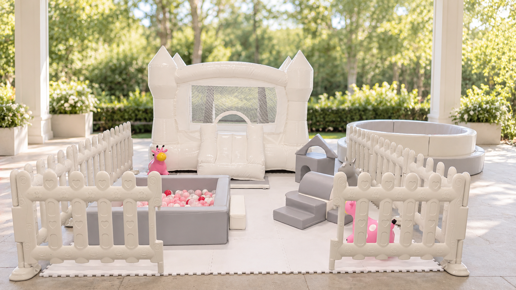 Luxury Bounce Events soft play setup with white fencing and ball pit