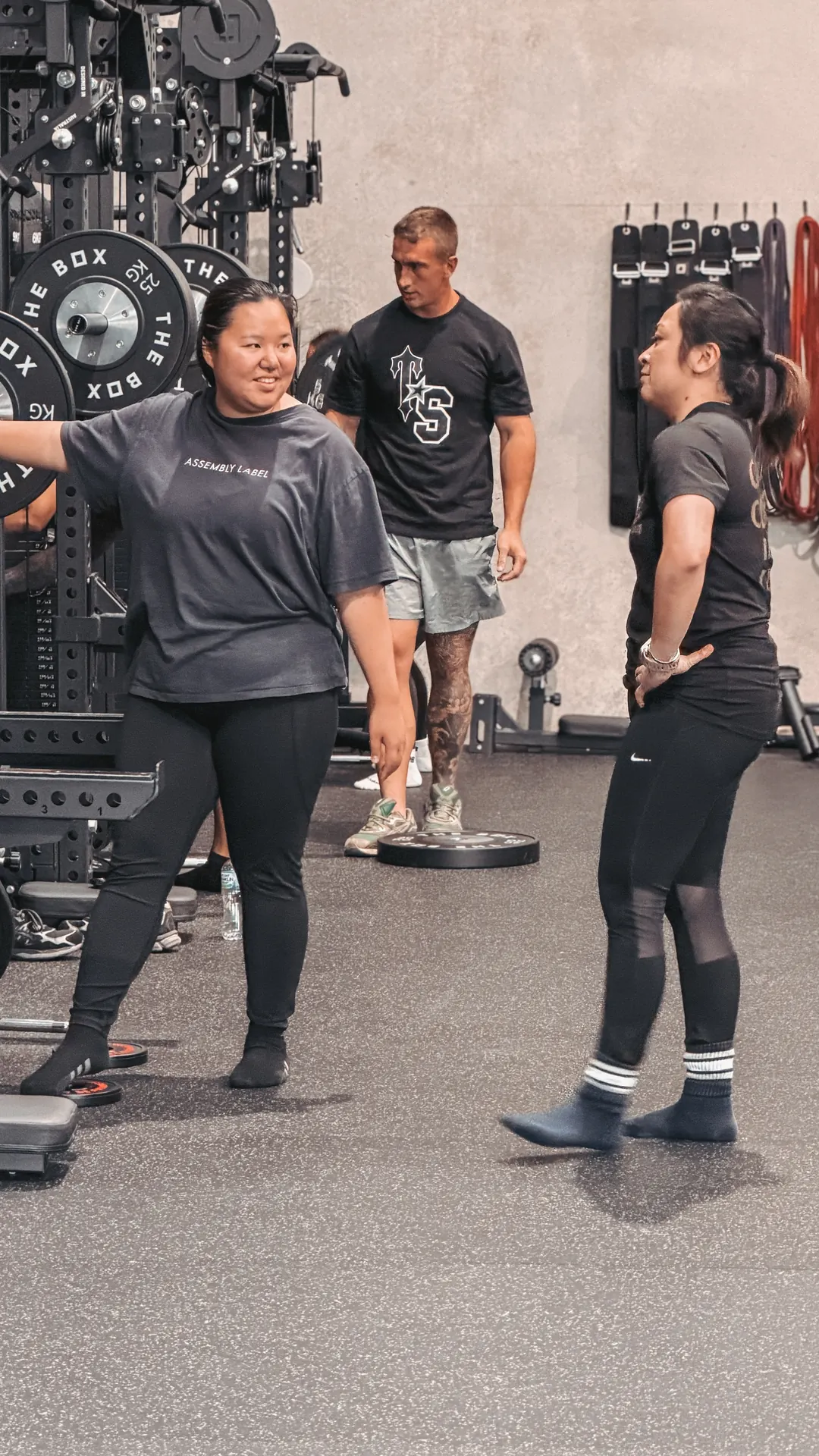 Two members and a coach laughing together