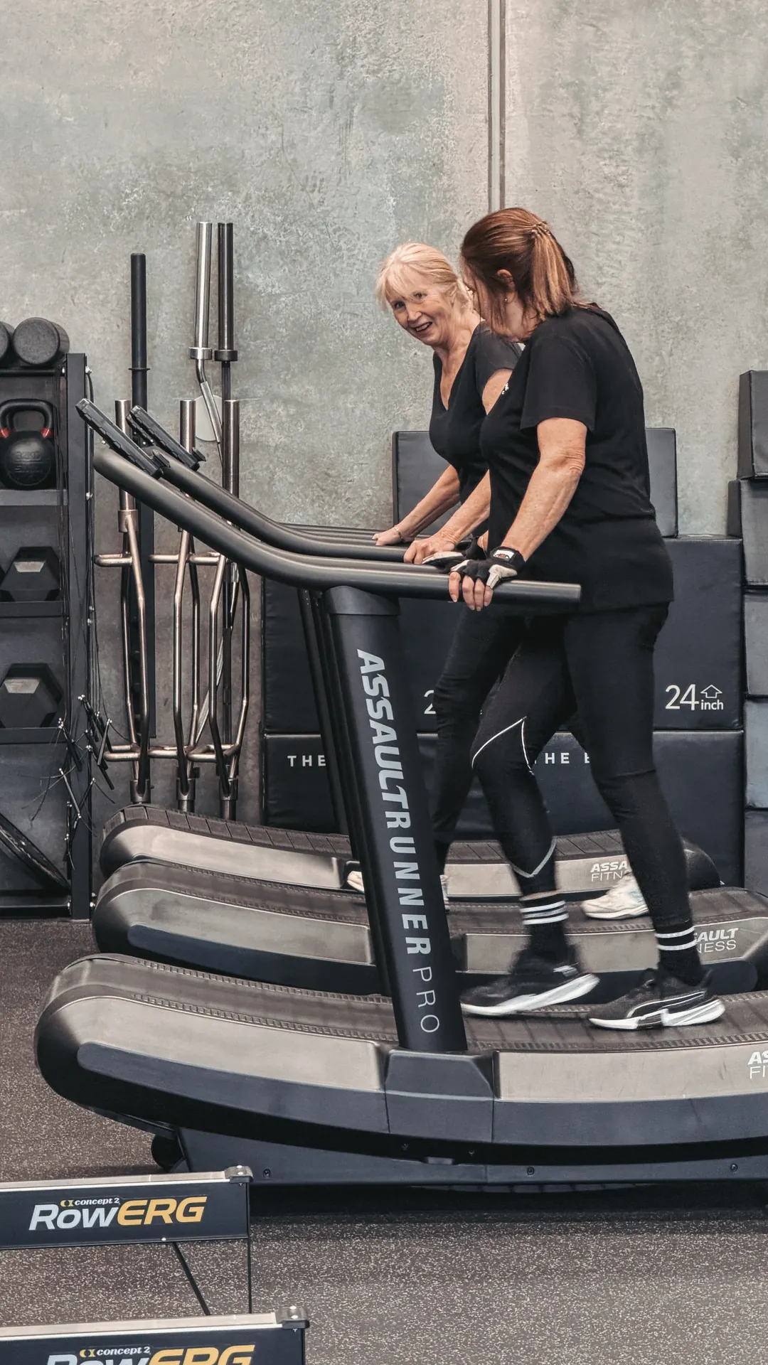 Two members smiling on the Assault Runners