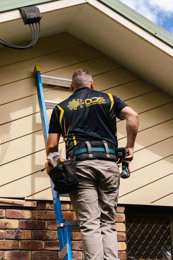 DDS installer working on security system wiring
