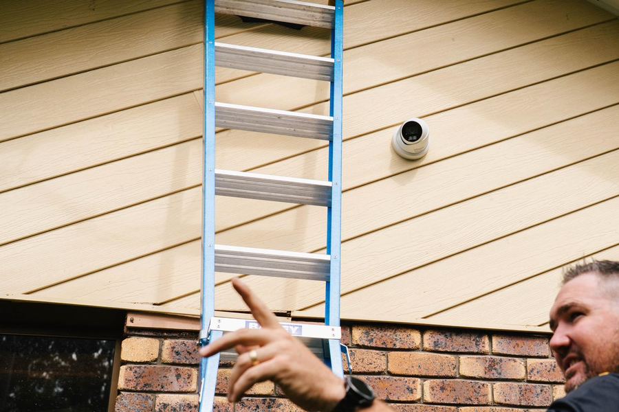 Close-up of cable work during security camera installation