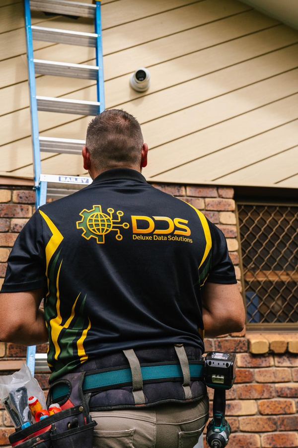 DDS technician mounting security device on service vehicle