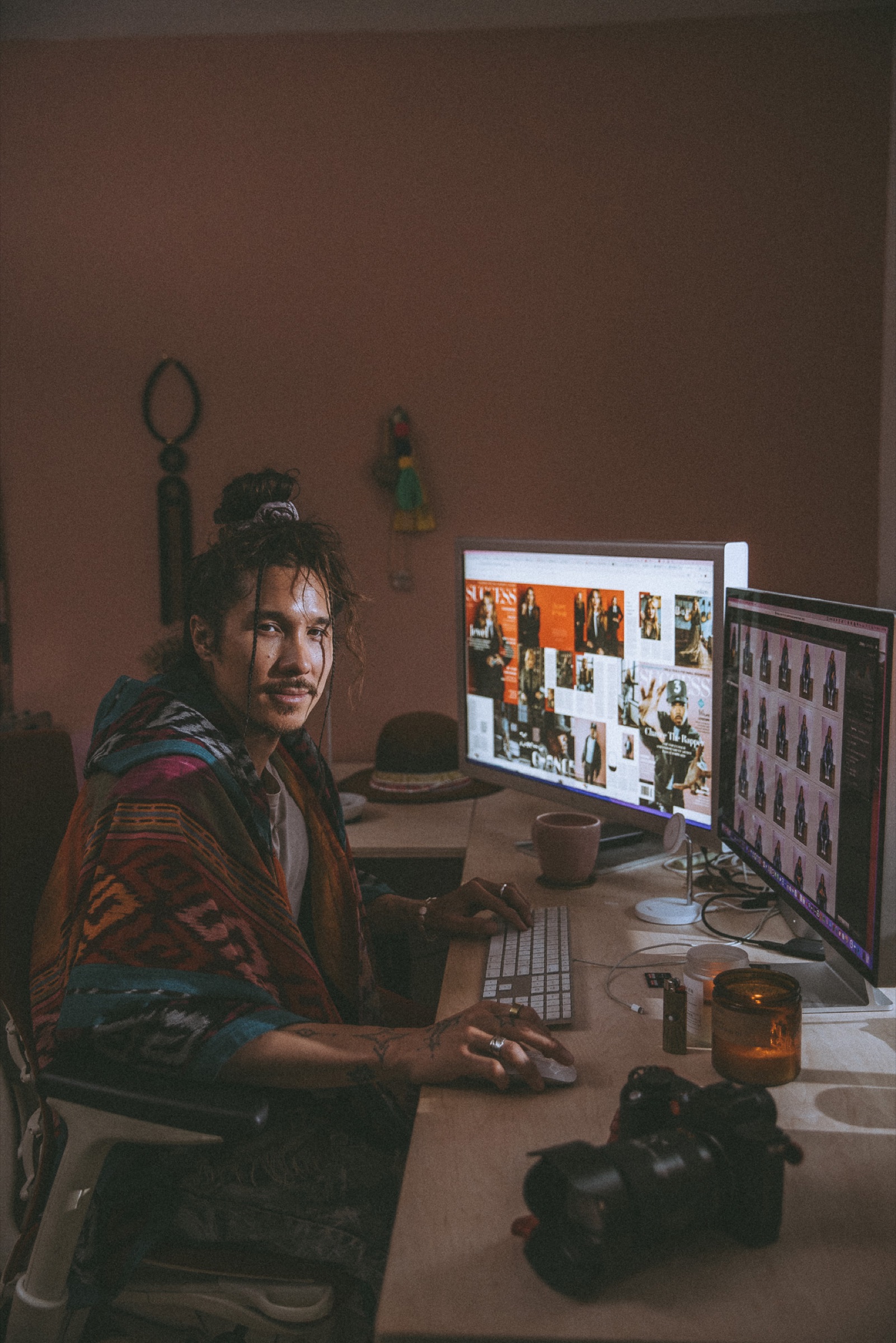 Nick Onken working at his desk with cameras and editing monitors