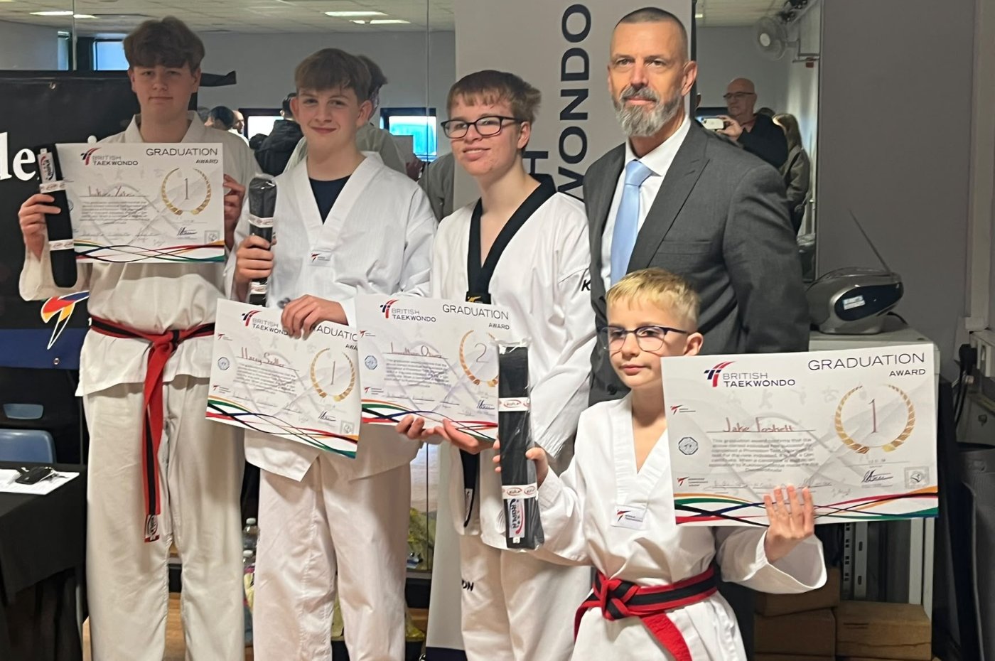 Warrior Taekwondo's new Black Belts and 2nd Dan with Head Coach Simon Jones Warrior Taekwondo's new Black Belts and 2nd Dan with Head Coach Simon Jones