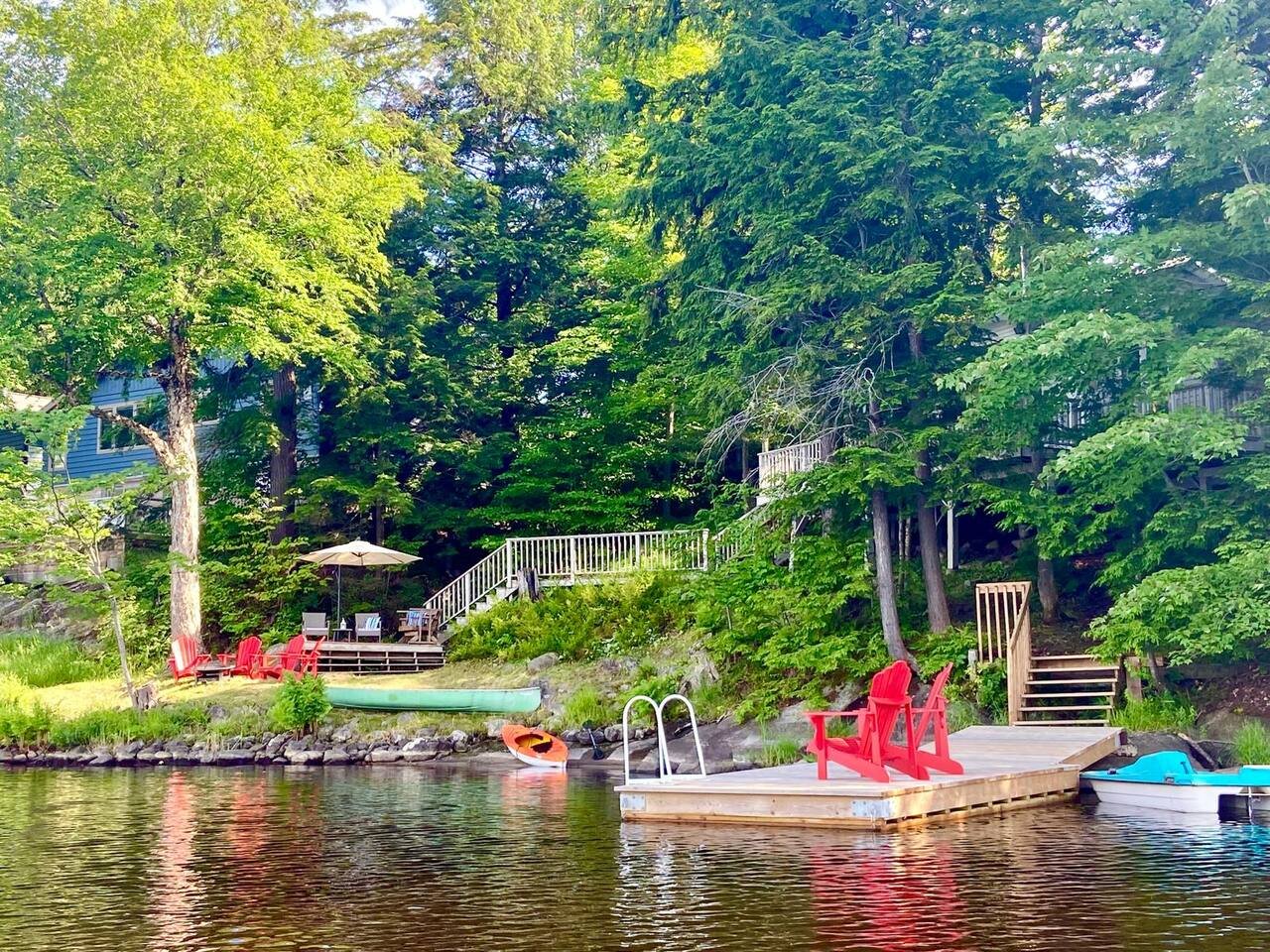 The cottage, deck and private dock from the lakefront