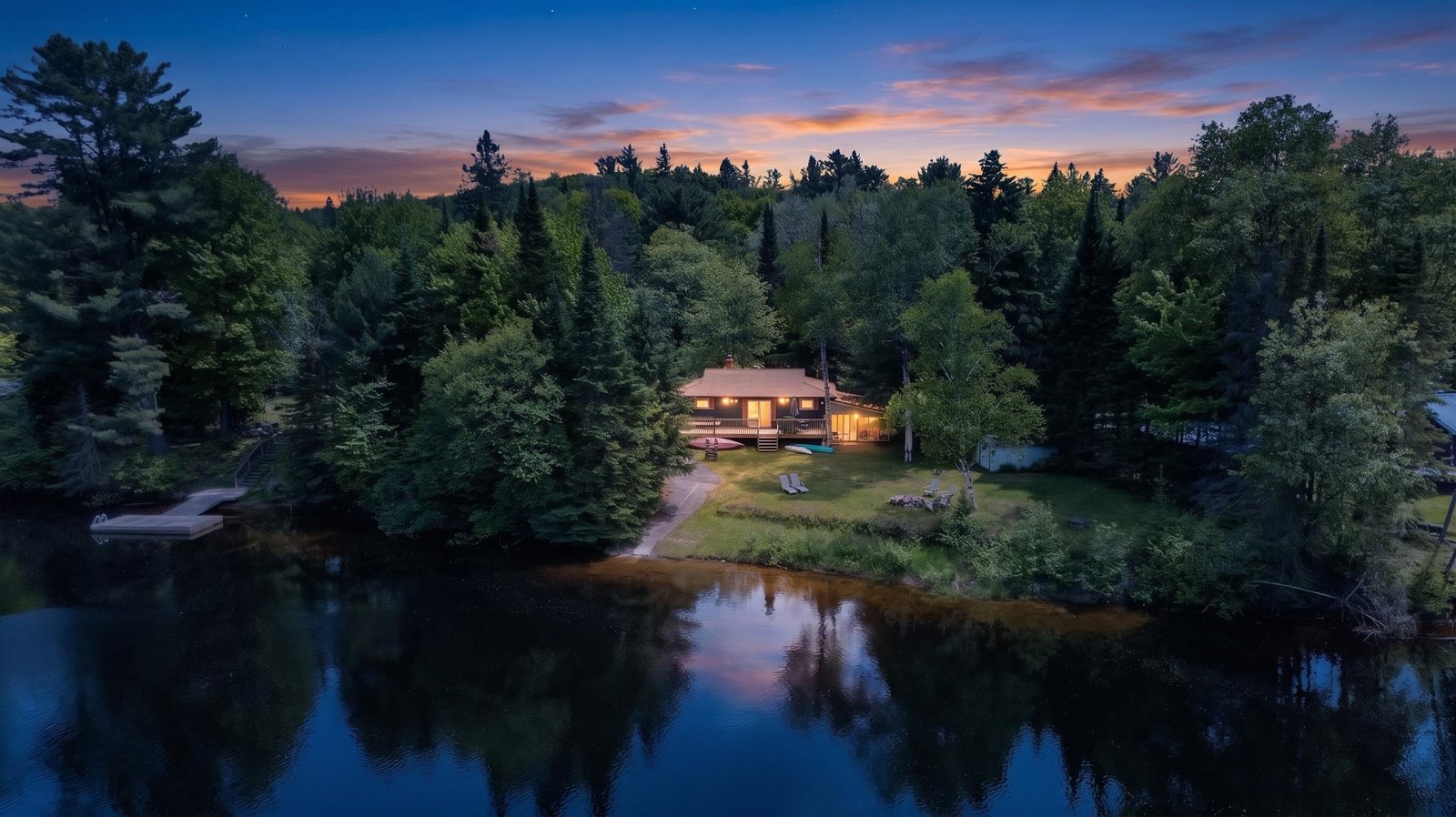 Secluded waterfront cabin at sunset
