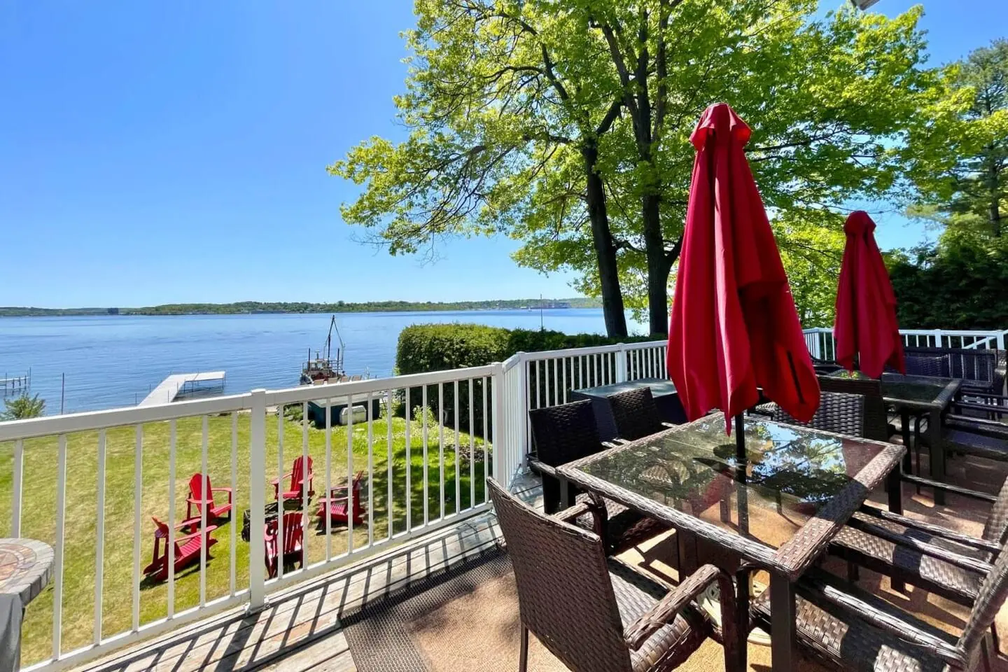 Outdoor dining table on the Bayside deck overlooking the water