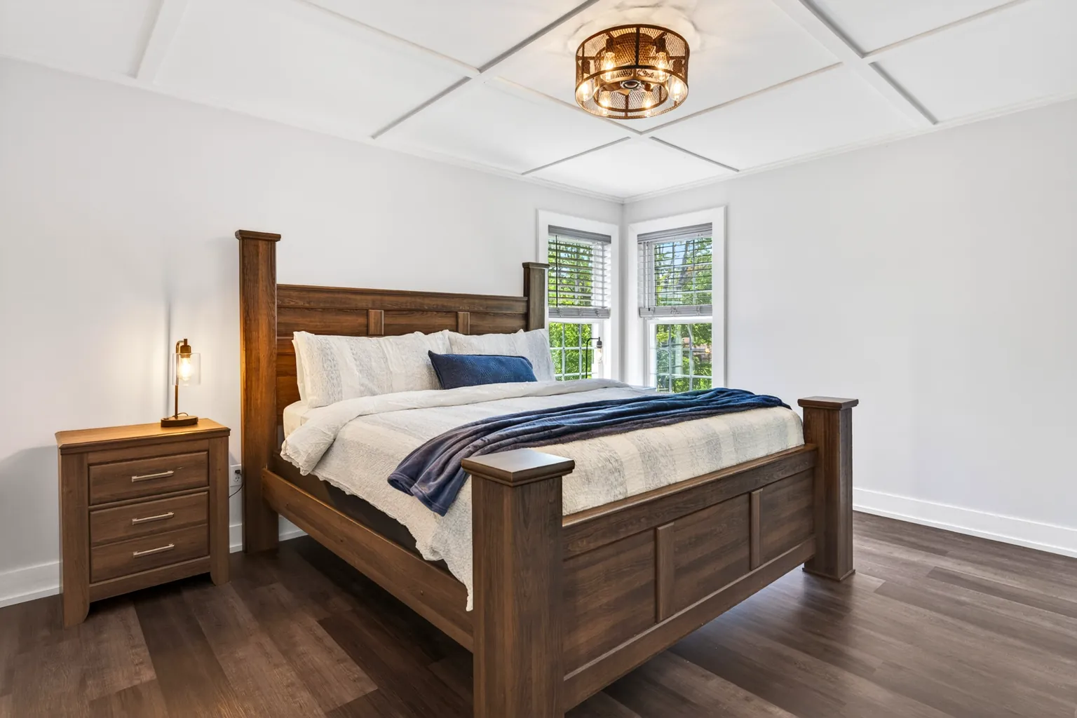 Primary bedroom at Good Times with a king bed and wood frame
