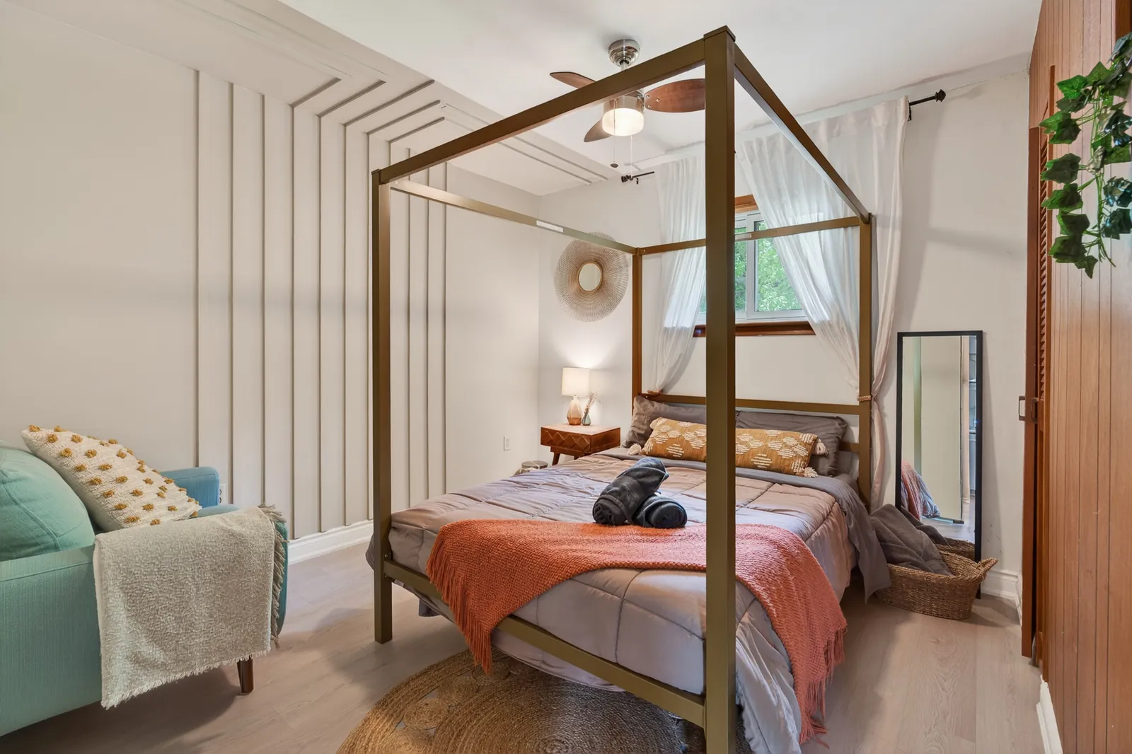 Bright bedroom at The Mara with a four-poster bed